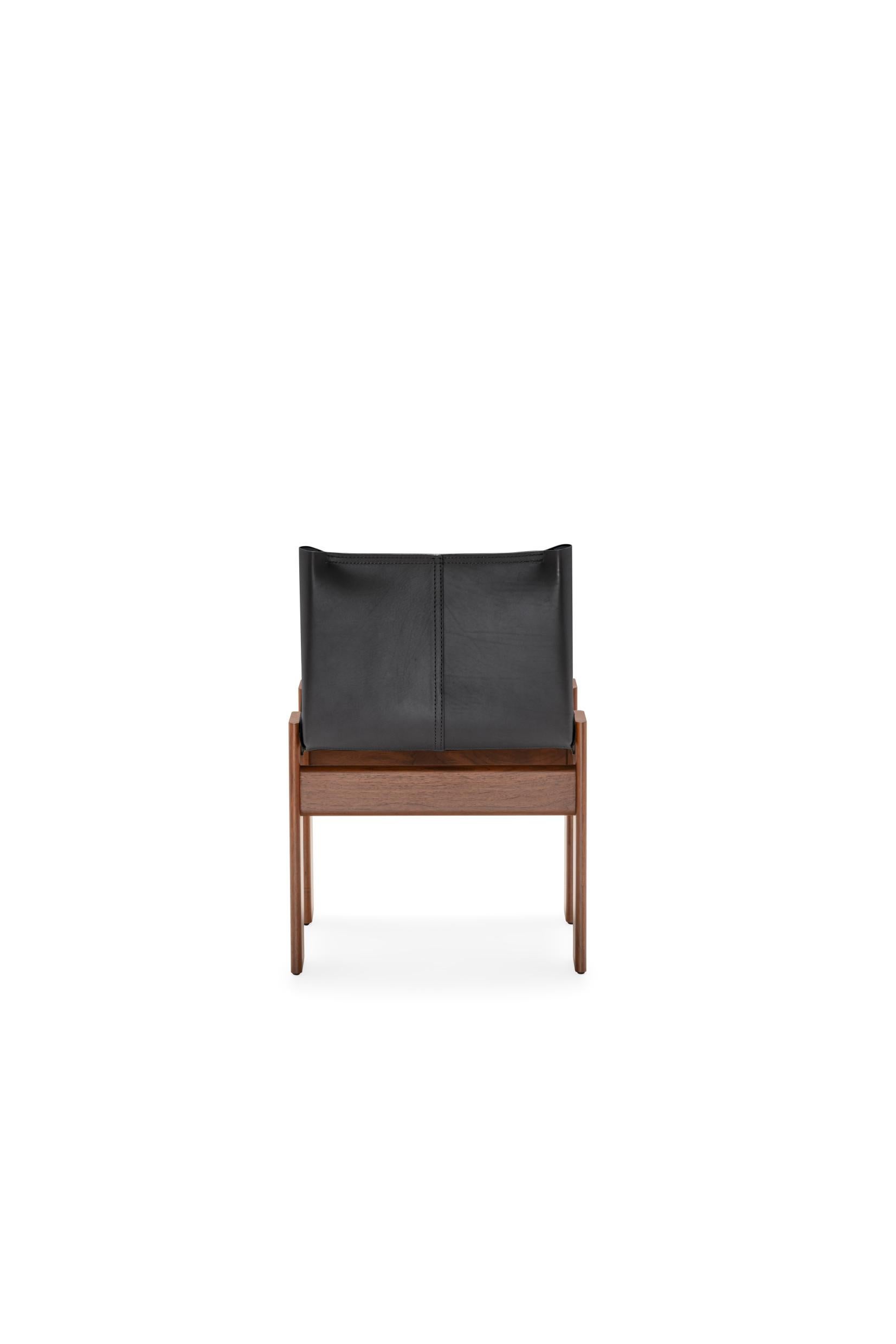 Originally designed by Afra and Tobia Scarpa for Molteni&C in 1973, the Monk chair is now featured as an exclusive re-edition in the Heritage Collection of Molteni&C. Crafted in Italy from American walnut, the chair’s slender, solid-wood frame