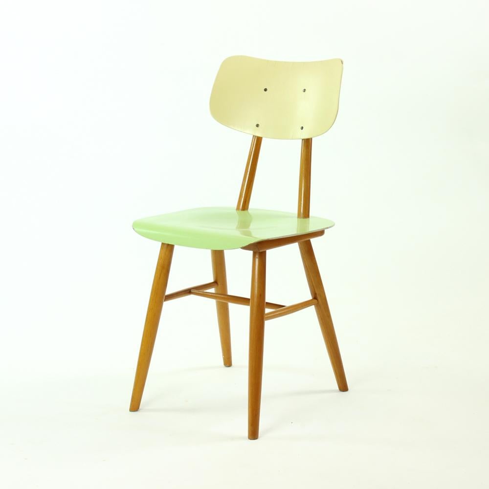 This charming chair was produced by TON company in 1960s. The model is also commonly known as kitchen chairs, because they often found their place by the kitchen table. The chair is fully made of wood. The seat is originally painted in light green