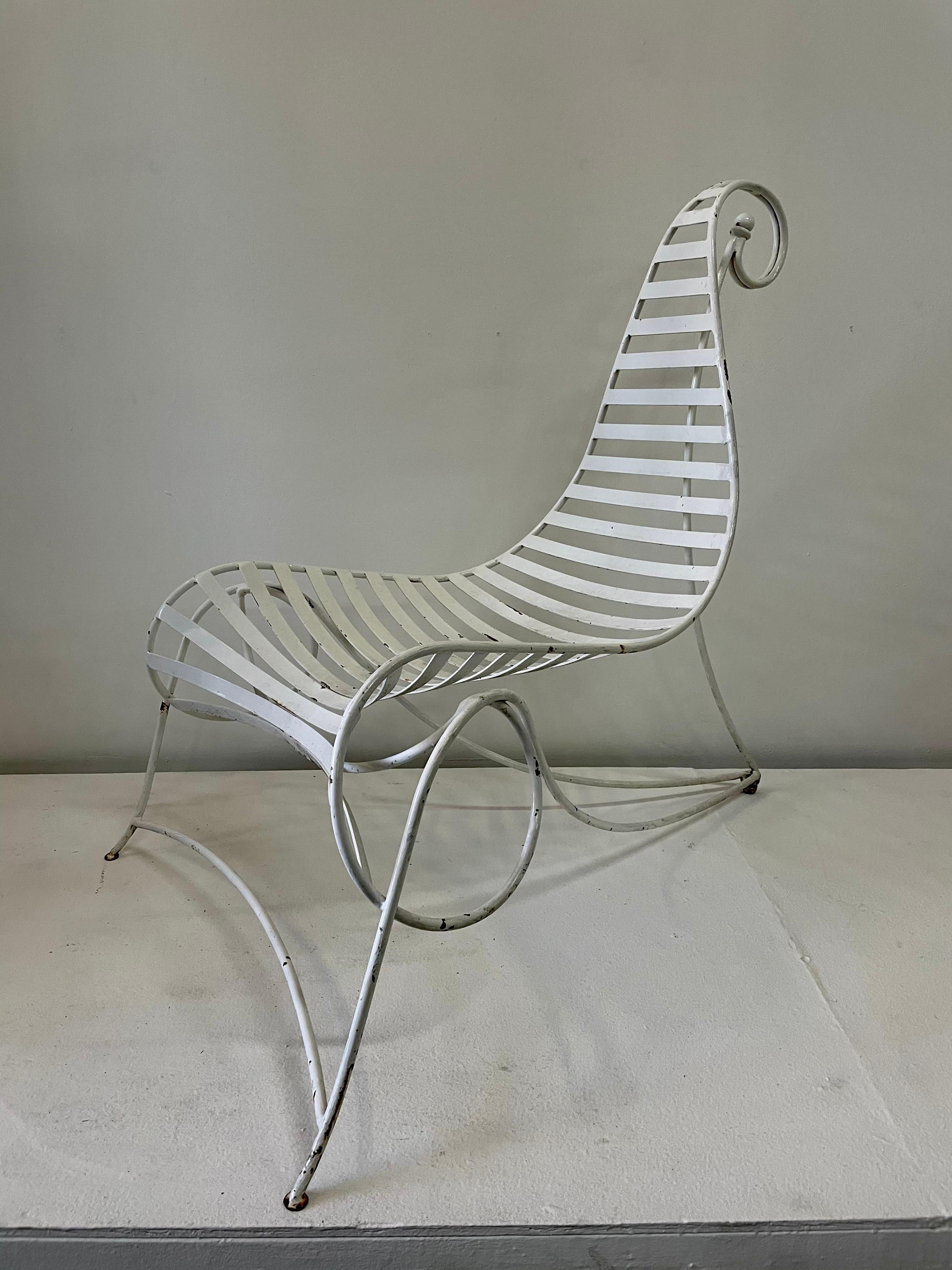 This whimsical and all vintage iron and metal chair is perfect for outdoors or indoors. Designed after André Dubreuil's iconic Spine chair.