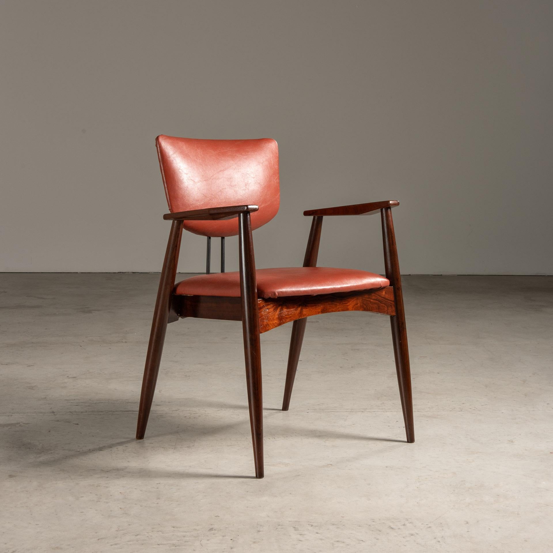 The chair designed by Michel Arnoult, a pivotal figure in the mid-20th-century Brazilian furniture movement, reflects the designer's commitment to practical, well-crafted, and accessible design. Arnoult was known for his pioneering work in flat-pack
