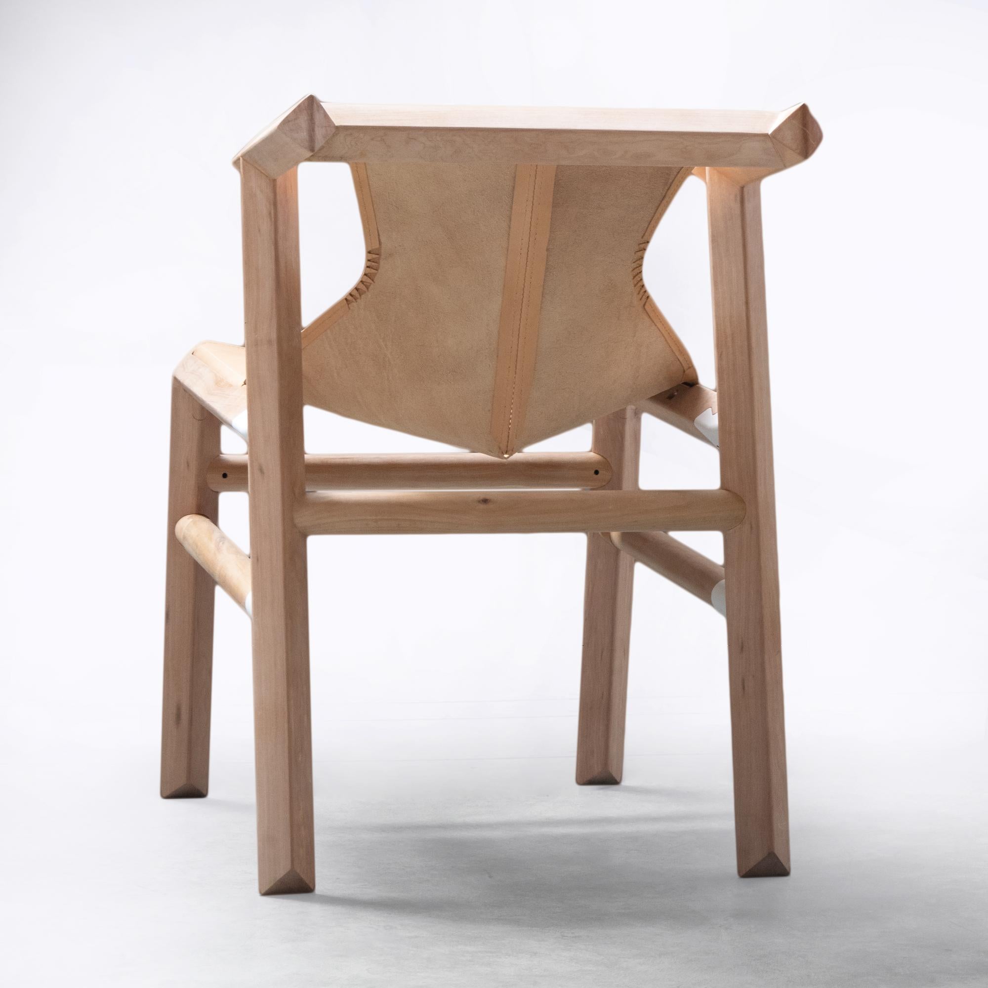 Hand-Crafted Dining room chair in wood and leather from Patagonia For Sale
