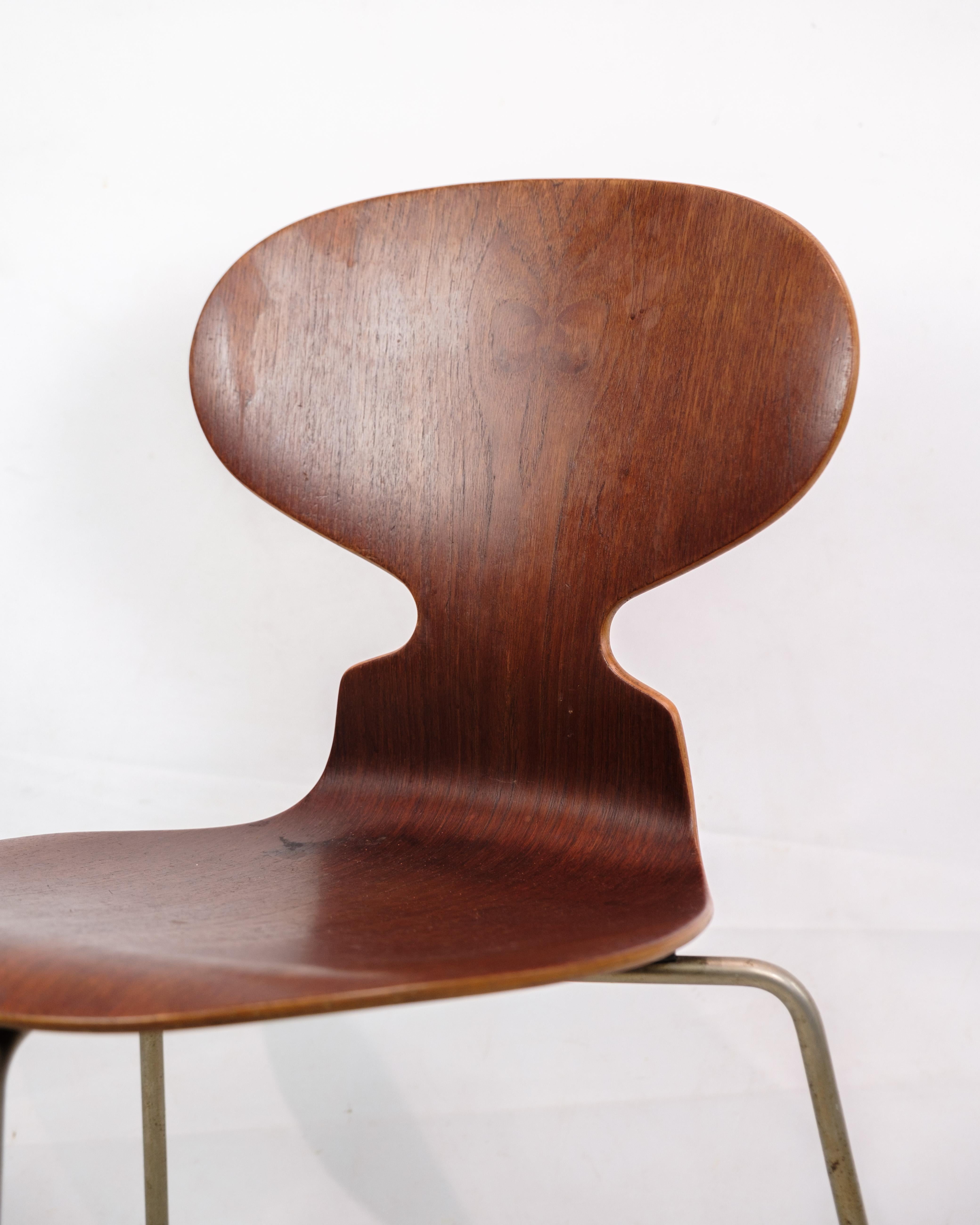This chair is known as the Model 3100 Myren, designed by the iconic Danish architect and designer Arne Jacobsen for Fritz Hansen in 1950. The chair is famous for its distinctive, organically shaped seat that resembles the silhouette of an ant,