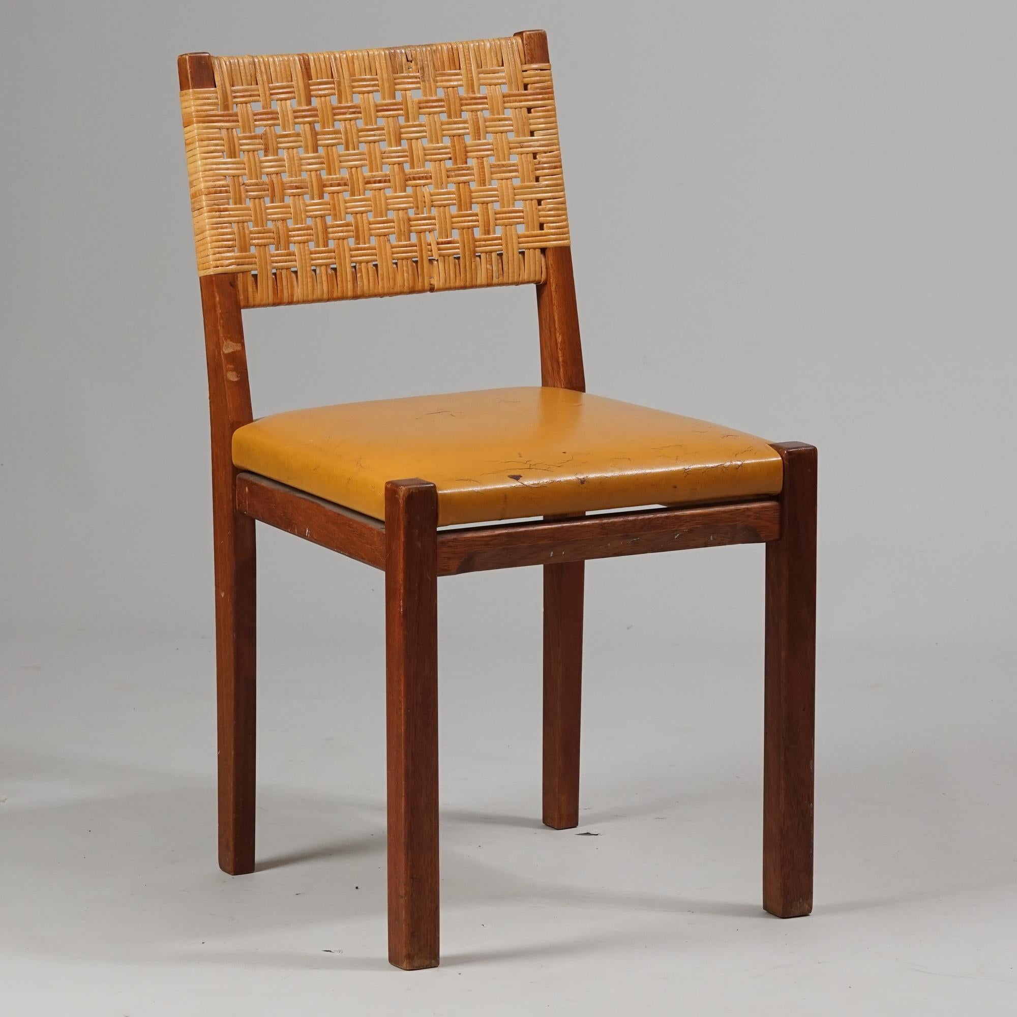 Chair Model 615 by Aino Aalto for O.Y Huonekalu- ja Rakennustyötehdas A.B from the 1950s. Teak frame with leather seating and beautiful rattan backrest. Good vintage condition, patina and wear consistent with age and use. A classic functionalist
