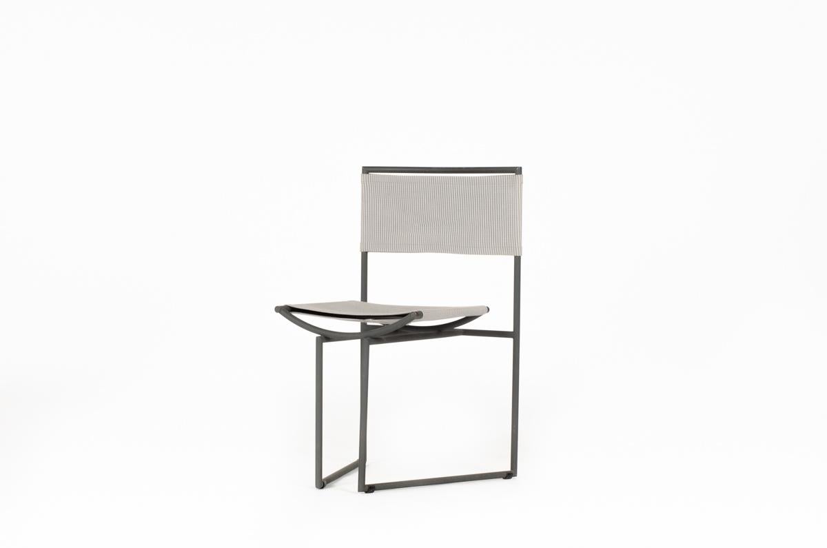 Chair, model 91, designed by Mario Botta, edited by Alias (see label under the seat)
made on the occasion of the 700th anniversary of the Swiss Confederation
Structure in gray lacquered metal, backrest and seat in stretched grey fabric 
Minimalist