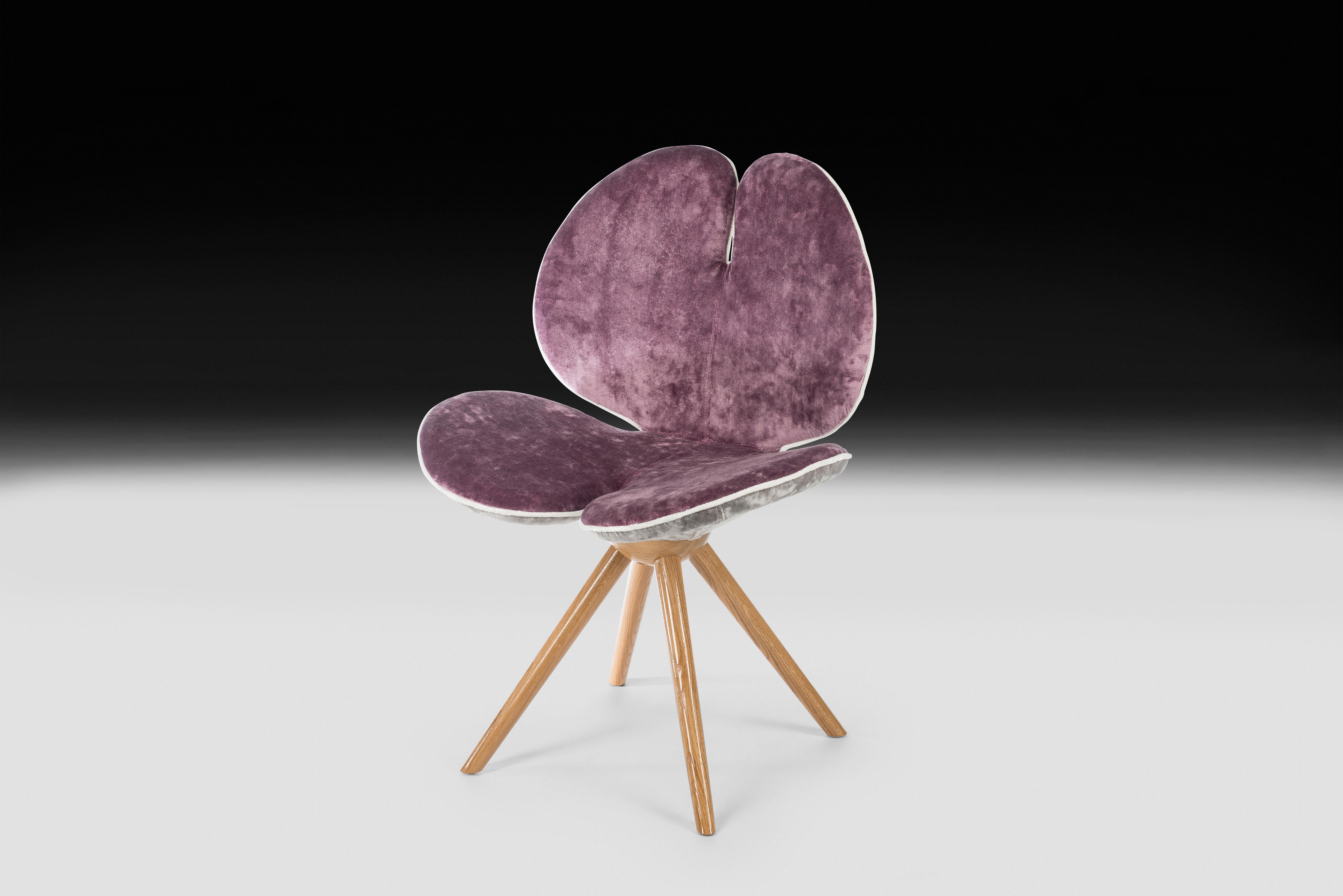 They are the harbingers of spring, nature awakens with them and colours emerge. Pansies are the inspiration for the new VG chair, with its slender legs of Canaletto walnut and the enveloping seat upholstered with fresh spring shades of Rubelli