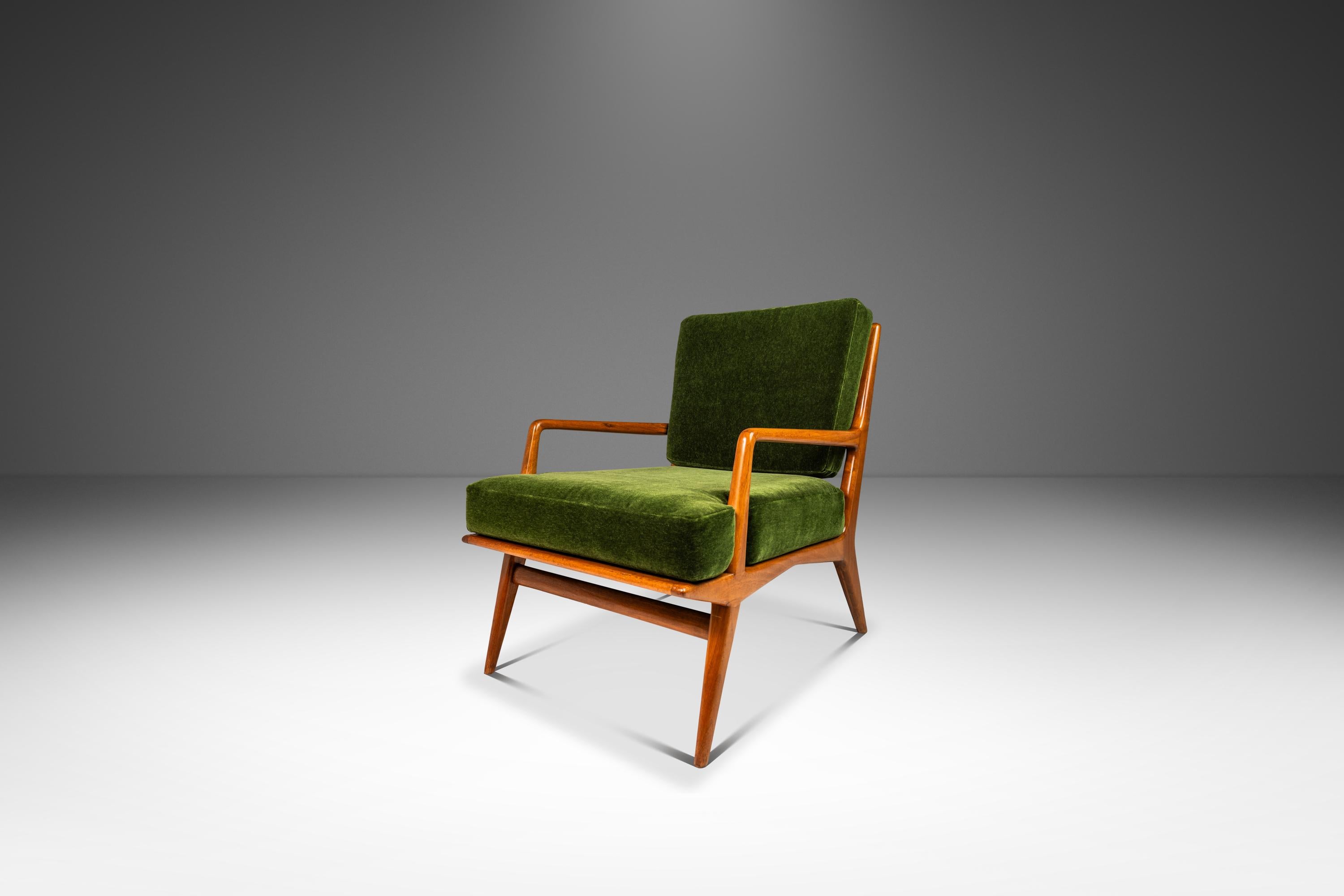 Introducing an incredibly rare lounge chair and ottoman set designed by the incomparable Carlo de Carli for the venerated M. Singer & Sons Furniture Co. Designed and produced in the mid 1950's this archetypally Italian Modern set was
