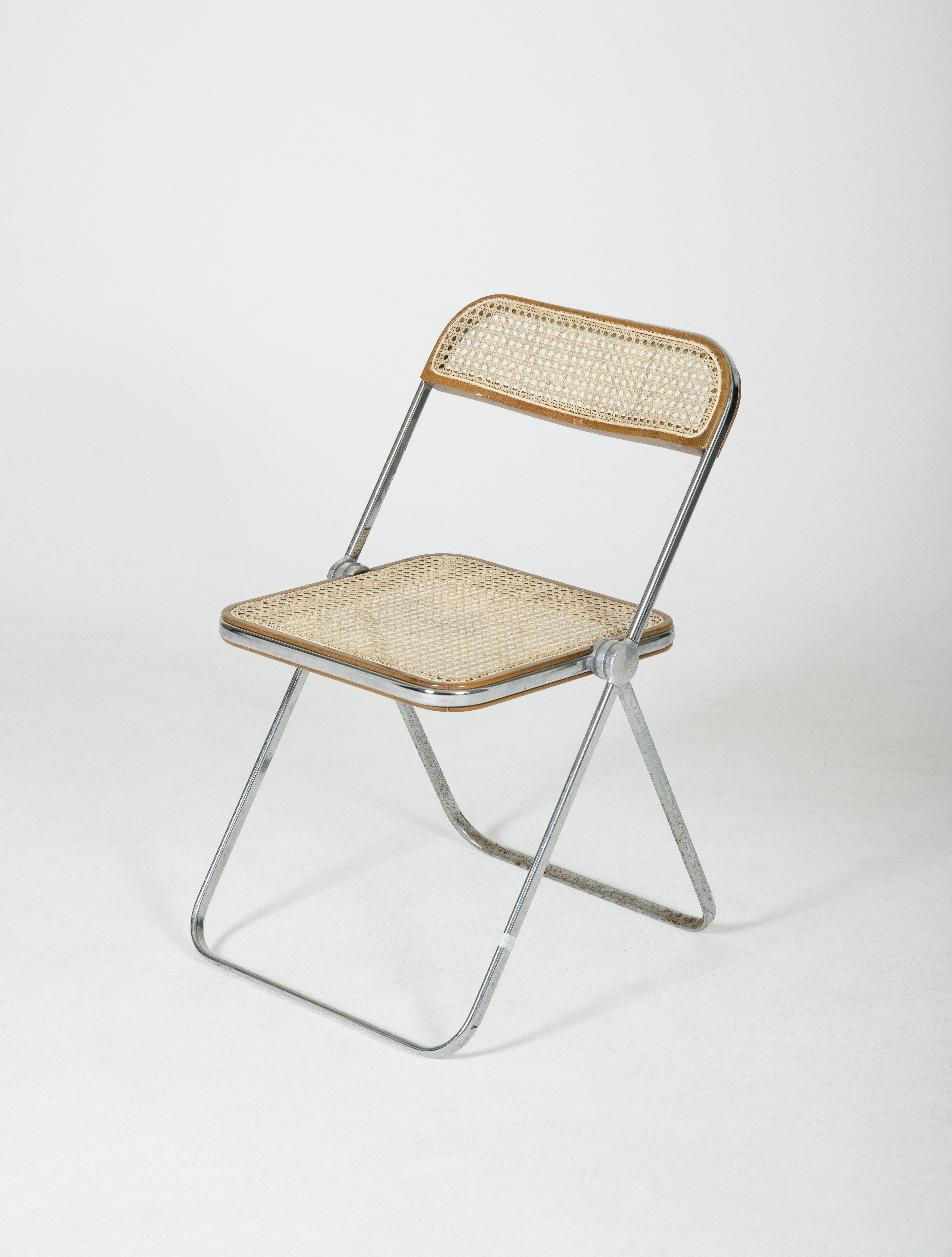 Plia chair by Giancarlo Piretti for Castelli in Italy in the 1960s. Chromed legs, back and seat in cane. Model of folding chair. The caning has been completely redone, some traces of wear on the base.
