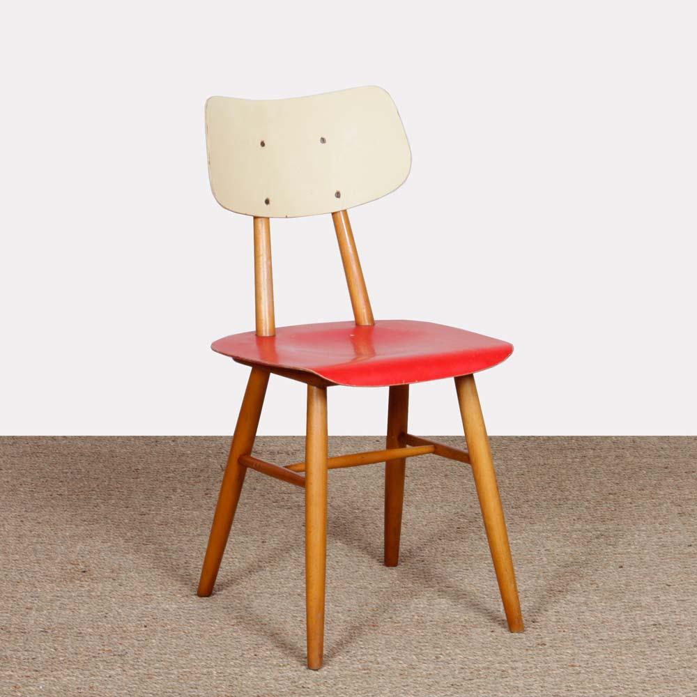 This chair was produced by Ton around 1960 in the Czech Republic. The seat and backrest are painted. This chair is in vintage condition. 