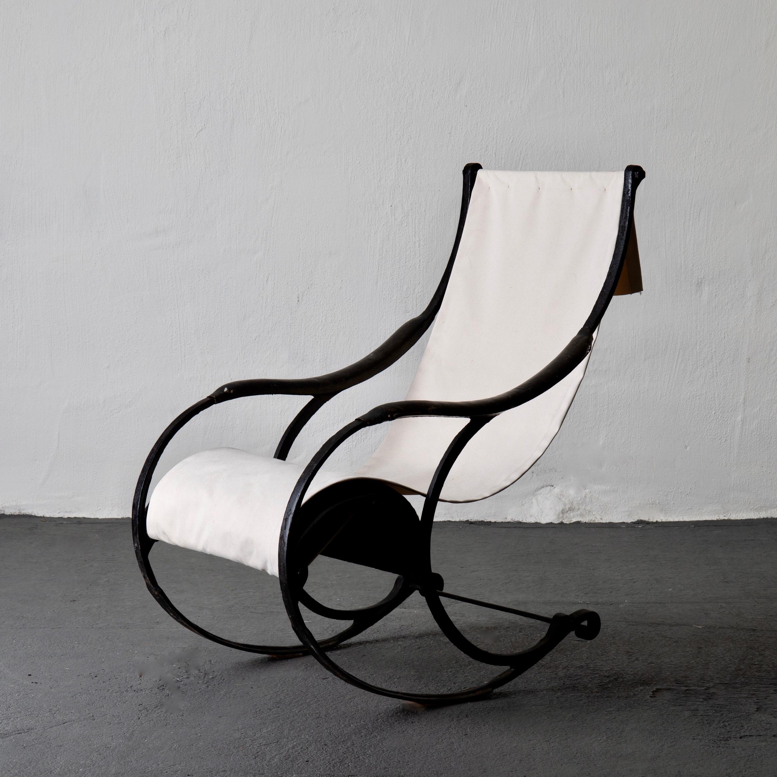 Chair rocking English 19th century black white, England. A stunning rocking chair made in England during the 19th century. Frame from cast iron. An off white canvas seat.