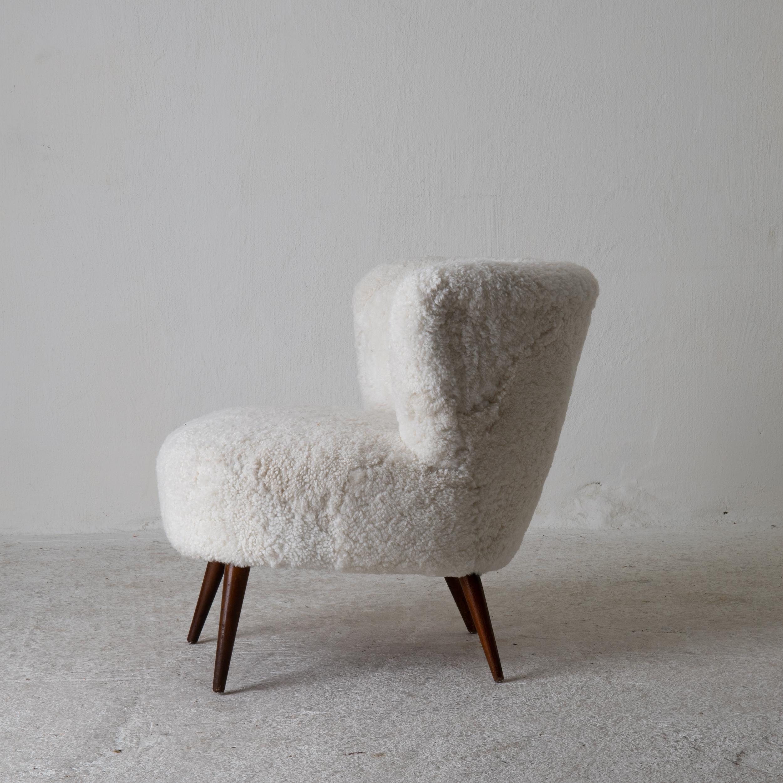 A single chair made during thee mid-20th century in Sweden. Upholstered in a white shearling fur.

  