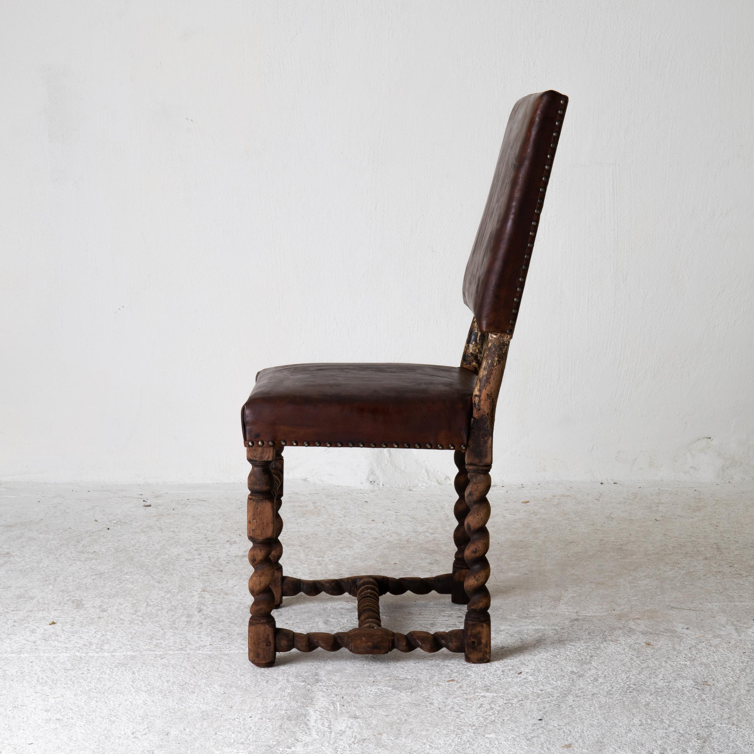 Chair side Swedish Baroque 1650-1750 brown leather Sweden. A side chair made during the Baroque period 1650-1750 in Sweden. Frame in unfinished oak wood. Seat and back upholstered in waxed vintage leather in brown.