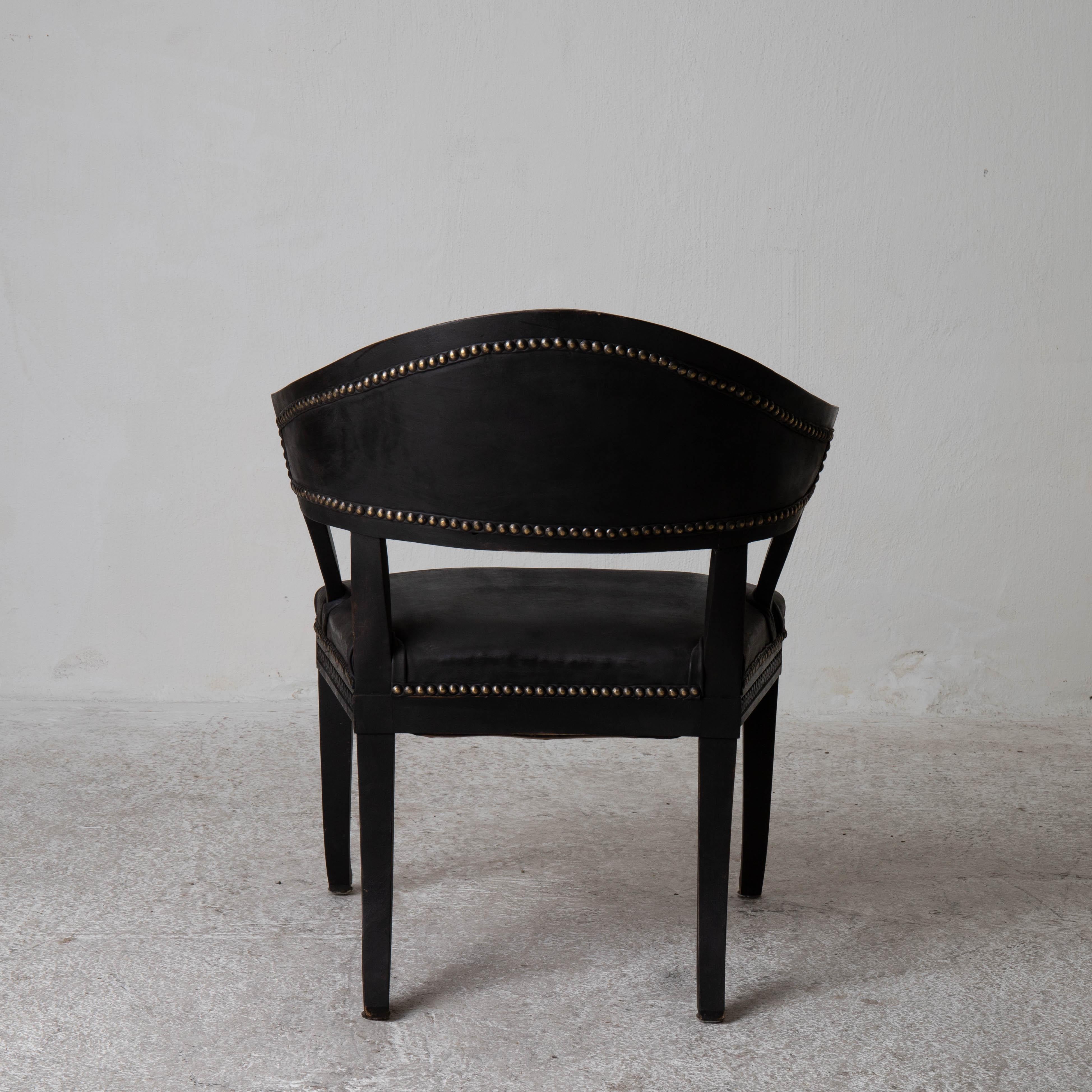 Chair Swedish Gustavian Style black barrel Back Sweden. A barrel backed chair made in the Gustavian style during the late 19th century in Sweden. Refinished in our Laserow Black and upholstered in a waxed leather. Nailhead detail.