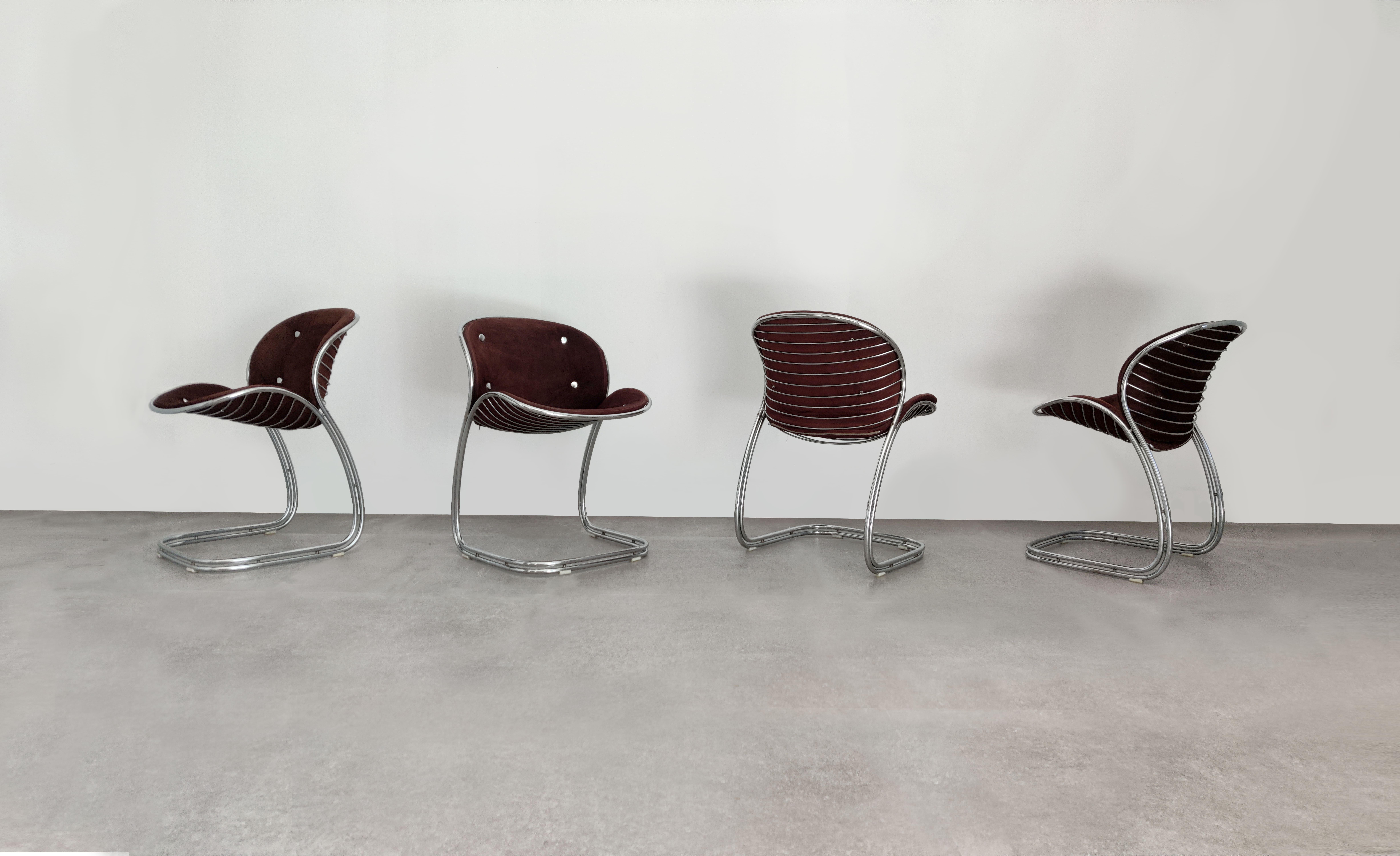 Add a touch of timeless elegance to your home with this stunning set of Sabrina chairs, designed by renowned Italian designer Gastone Rinaldi and produced by Vidal Grau. The chairs feature a sleek and sturdy chrome frame that beautifully complements