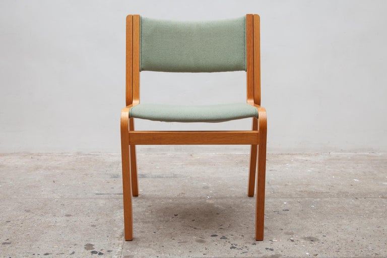 A high quality of curved laminated wooden stacking chairs with woven wool upholstery in olive green.
Set of 24 stacking chairs available, price a piece.

Johnny Sorensen was born in Helsingor, son of factory workers and appointed as unskilled