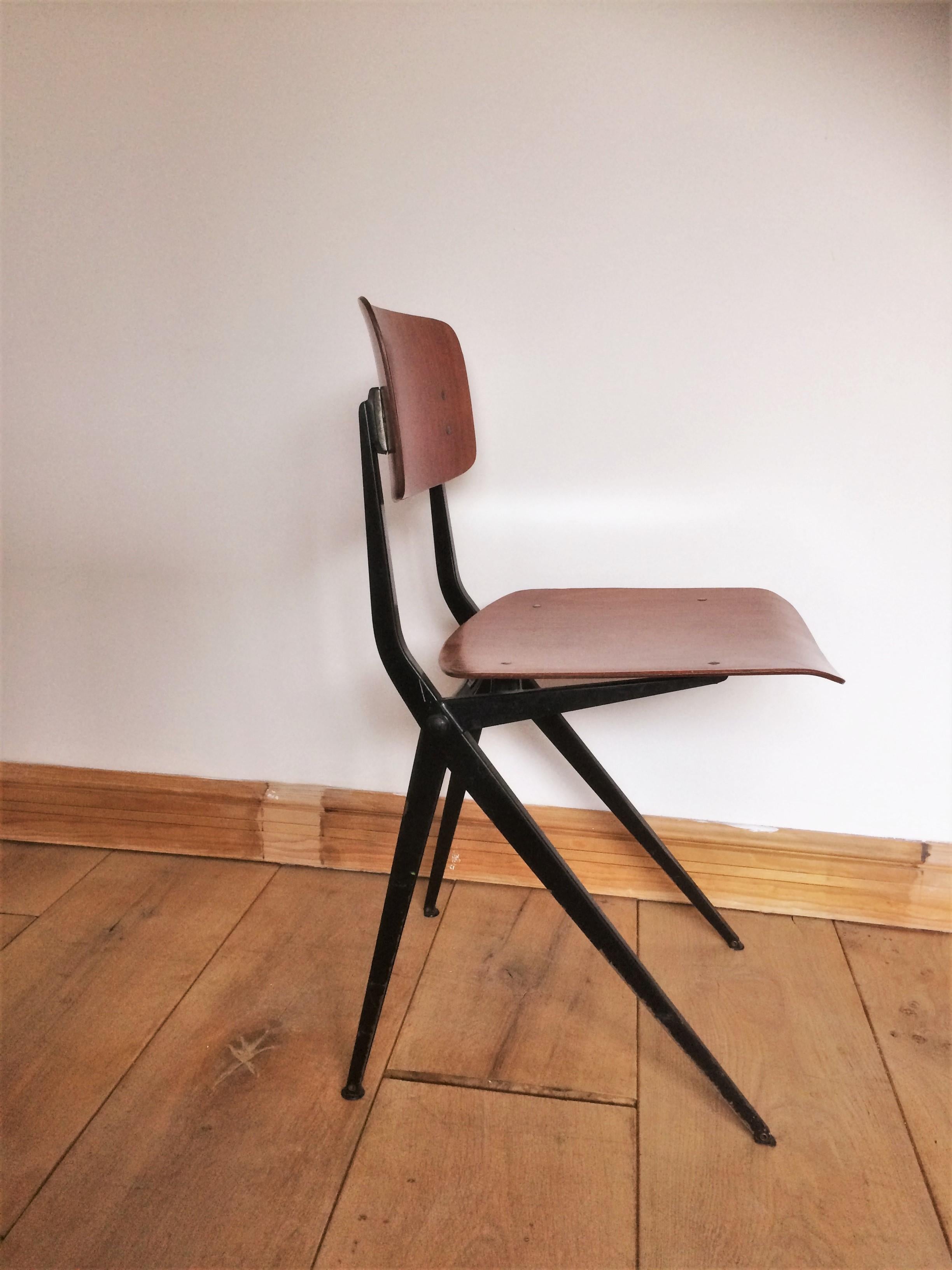This set of 4 Industrial chairs manufactured designed by Ynske Kooistra for Marko in Holland during the 1960s features a black metal frame with seats and backrests in pagwood. This design is reminiscent of Jean Prouve, Friso Kramer and Rietveld's