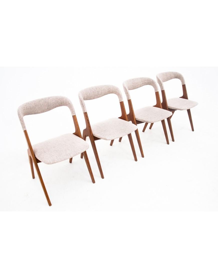 Danish chairs from the 1960s. 

An unusual shape of chairs with a beautifully profiled backrest that increases the comfort of use. Classic, minimalist Danish design. The chairs will fit perfectly into contemporary interiors. 

Furniture in very good