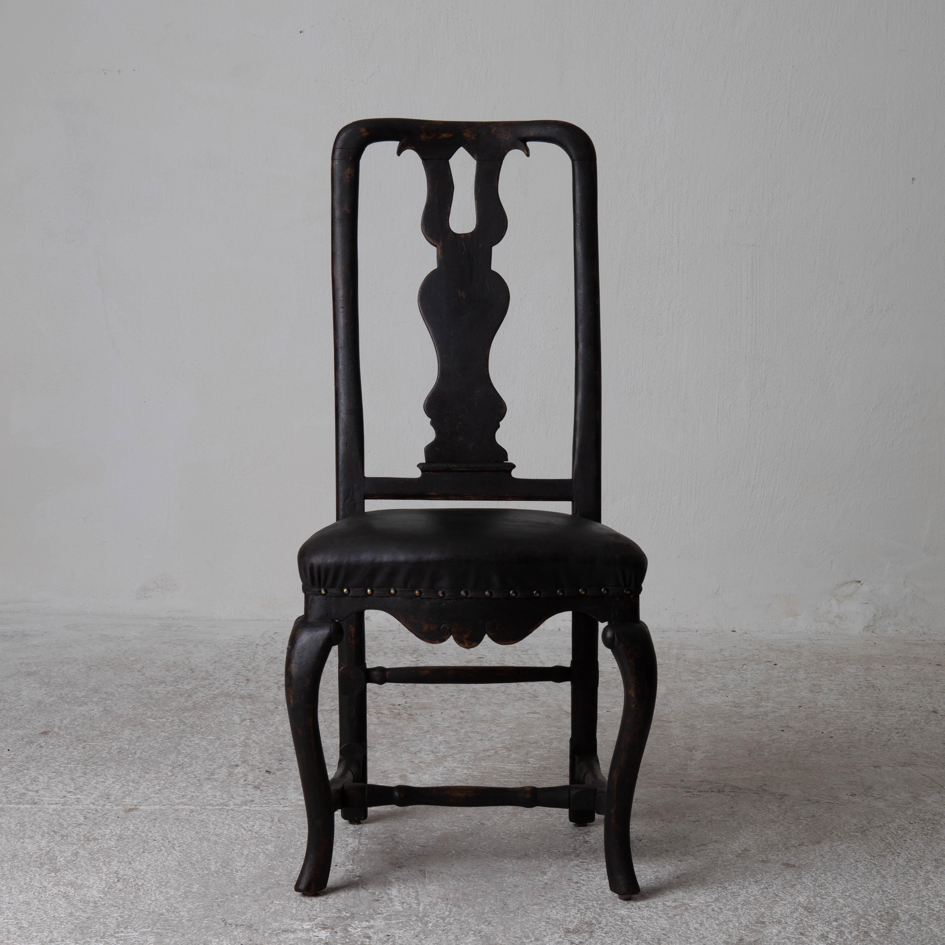 Chairs dining room chairs Swedish Baroque black Sweden. An assembled set of six chairs made during the Baroque period in Sweden. Refinished in our Laserow Black and upholstered in a black vintage leather. Nailhead details.