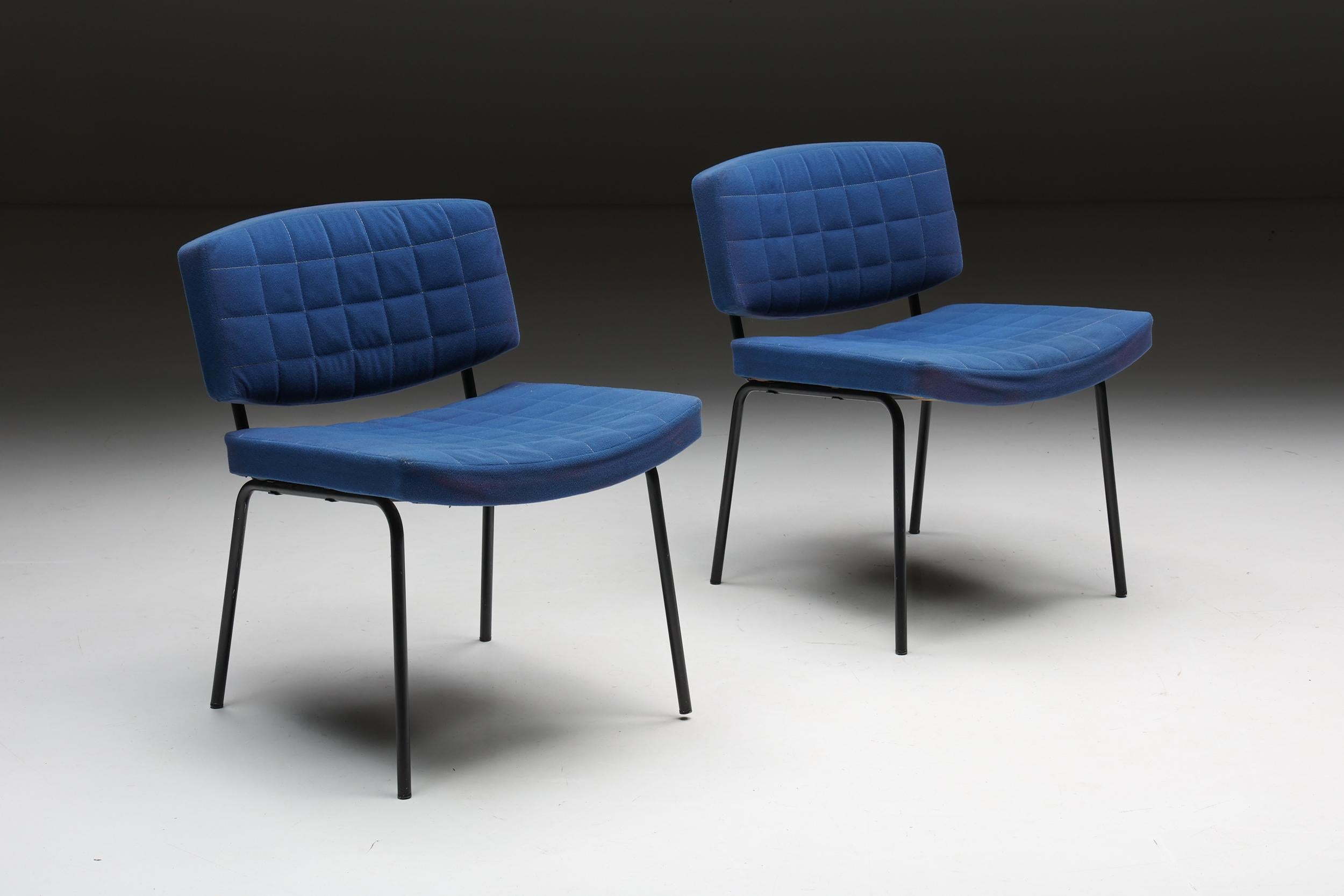 Chairs; blue fabric; upholstery; tubular metal frame; modern; living room; dining chairs; office chair; Mid-Century Modern; Industrial; Minimalist; Postmodern; 

Chairs with blue upholstery and a tubular metal frame. Minimalist side chairs with a