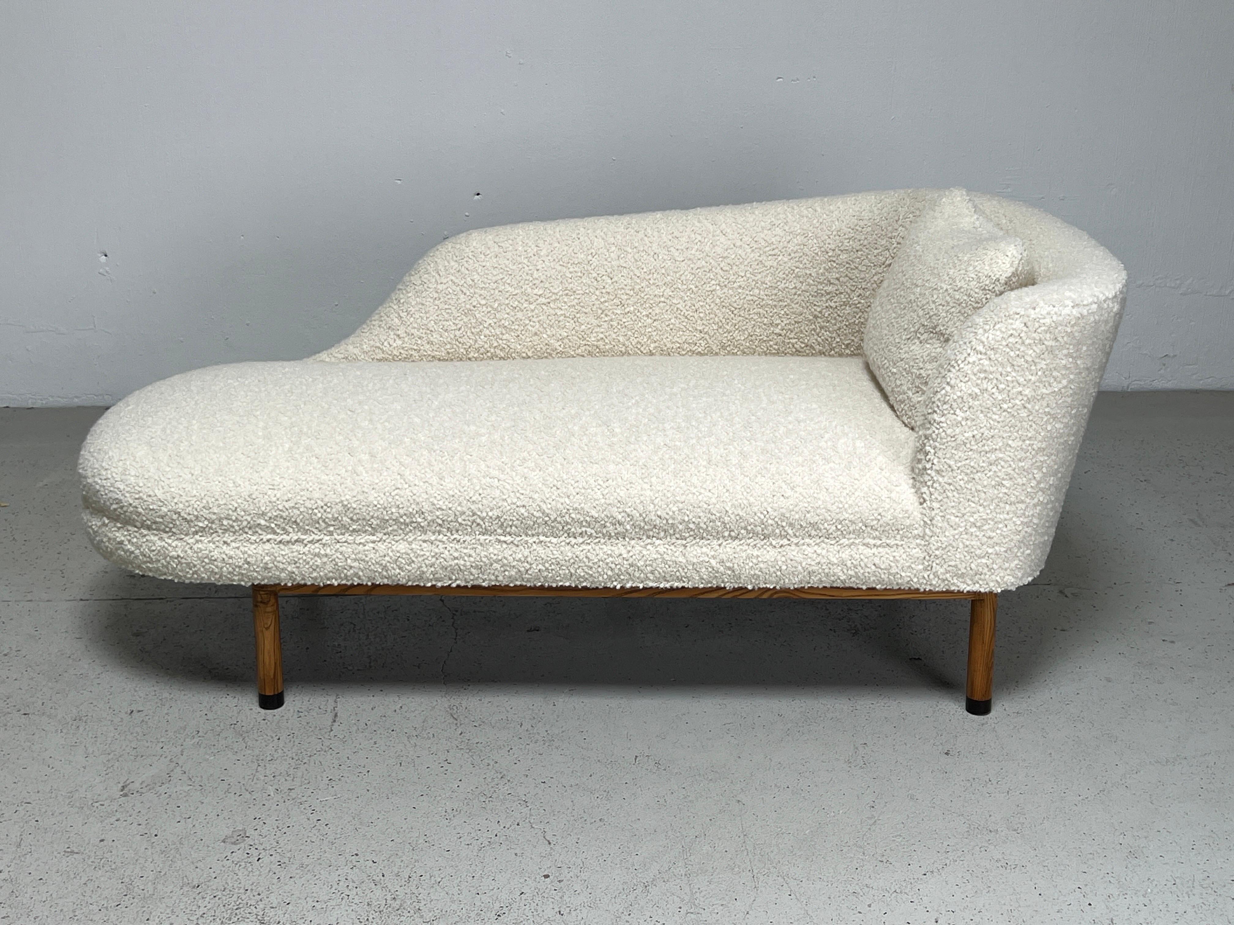 A right arm chaise lounge designed by Edward Wormley for Dunbar. Ash base with Ebony feet. Fully restored and upholstered in Holly Hunt / Teddy / Winter White. Matching left arm chaise also available.