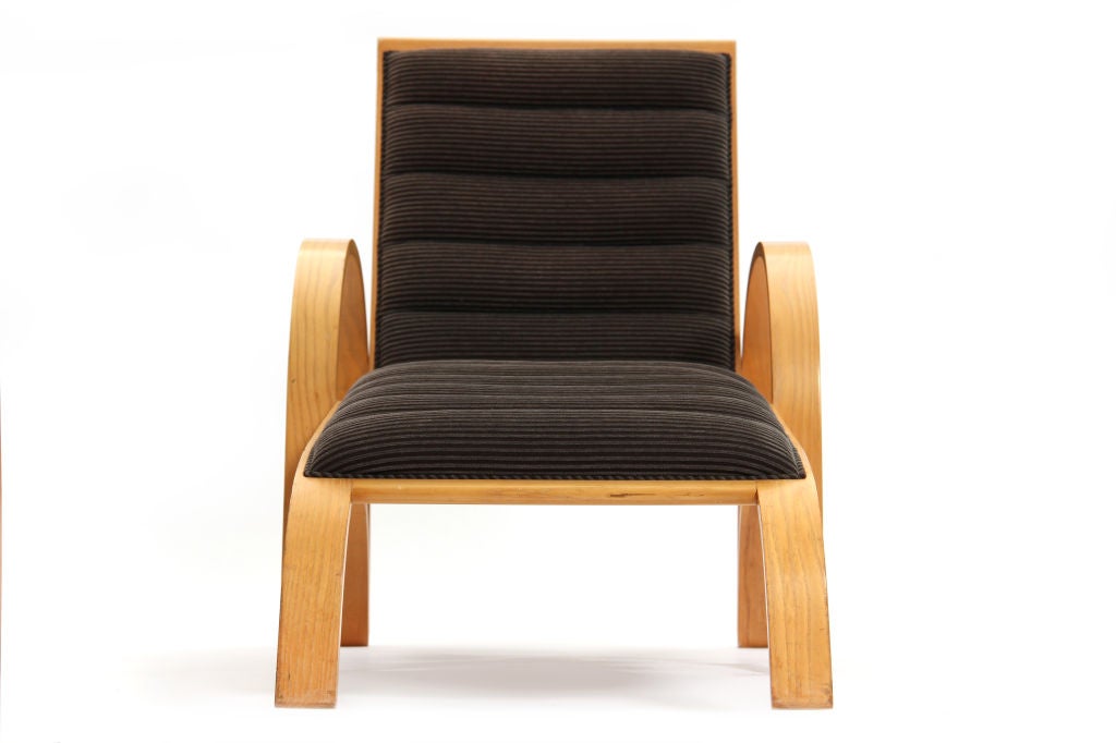 A solid ash chaise longue with an adjustable recliner and original channeled upholstery.