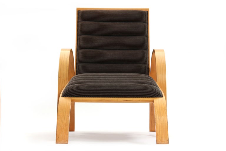 A solid ash chaise longue with an adjustable recliner and original channeled upholstery.