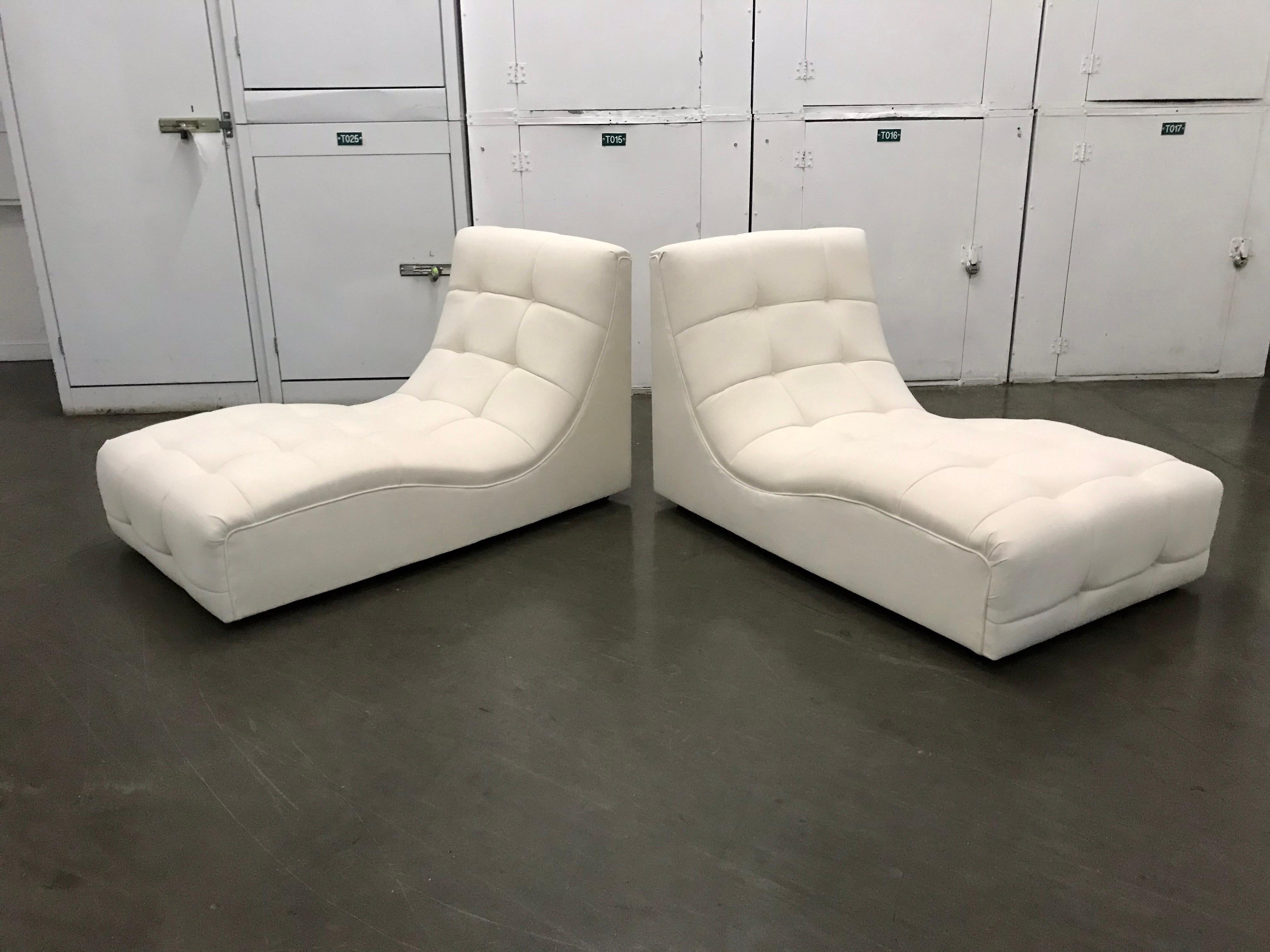 Handsome pair
Wood construction with wood castors and soft cream hue fabric
Reupholstered in the same window pane manner as found
Great for a living room or lanai etcetra.

 