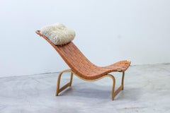 Chaise longues by Bruno Mathsson with sheepskin cushion, Leather and birch 1940s