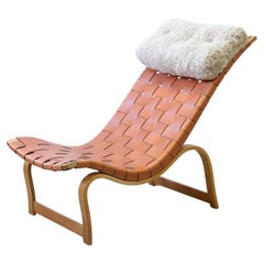 Used Chaise longues by Bruno Mathsson with sheepskin cushion, Leather and birch 1940s