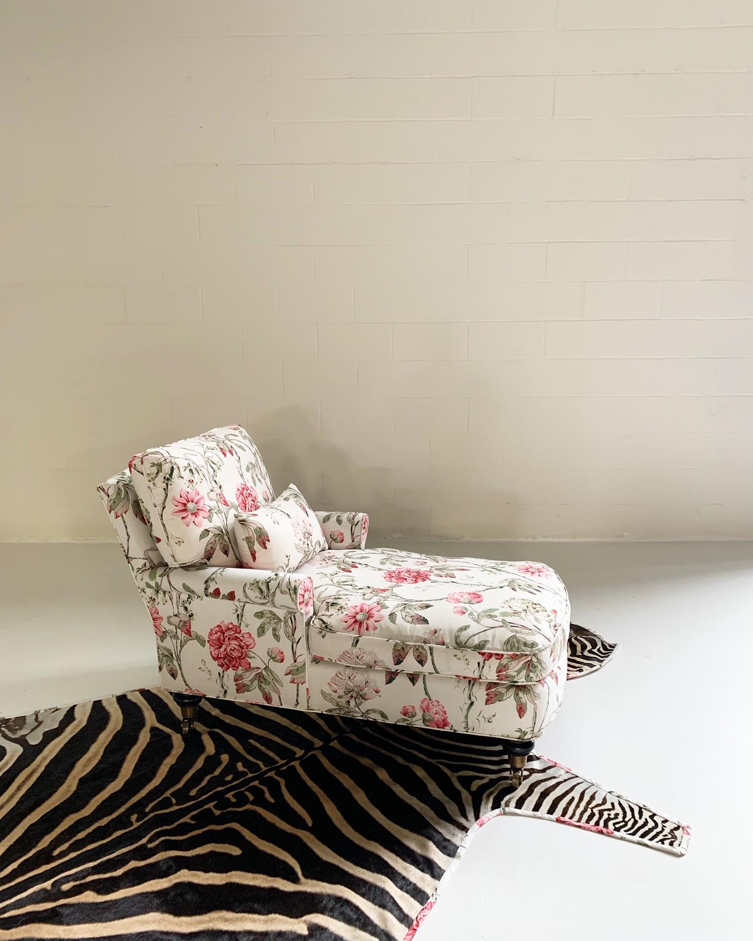 Inspired by the chintzy florals on the set of 1985s Out of Africa, our designers chose Schumacher's Daydream fabric in Fuschia colorway for this traditional chaise lounge. Restored from the bones out with lots and lots of feathers, we nixed the