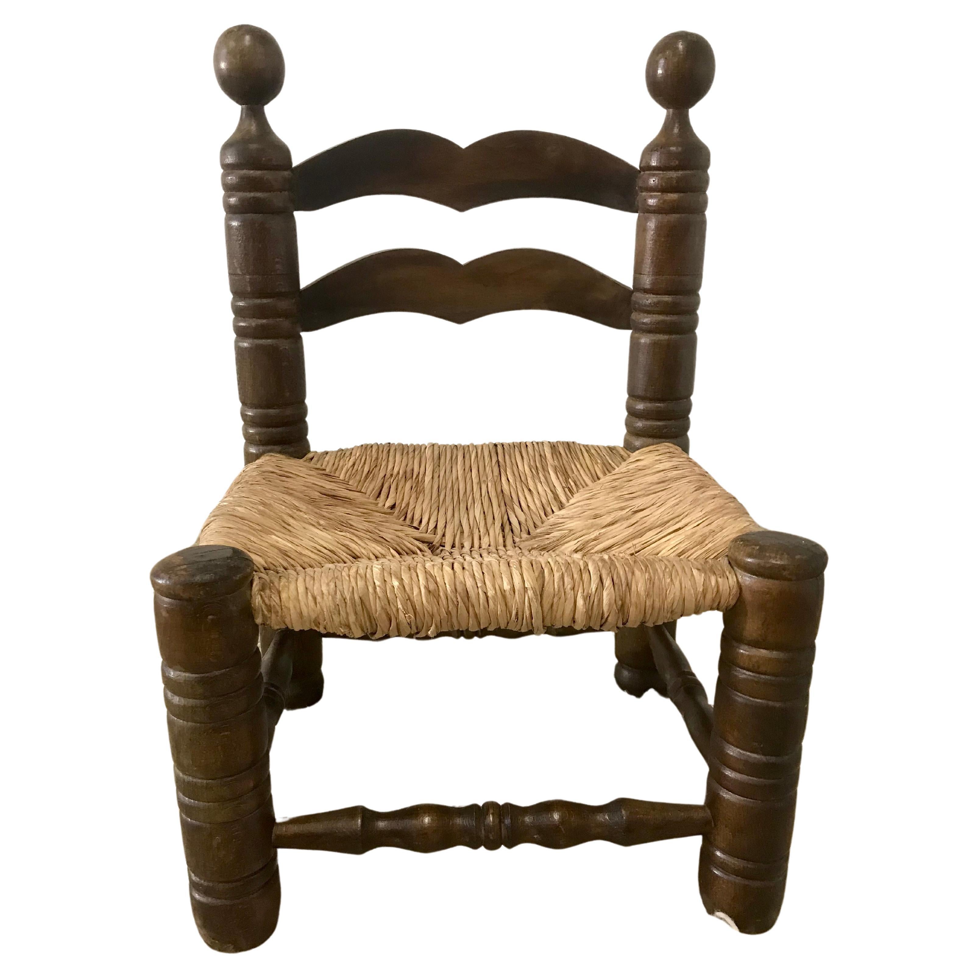 Chaise paillée Georges Robert For Sale