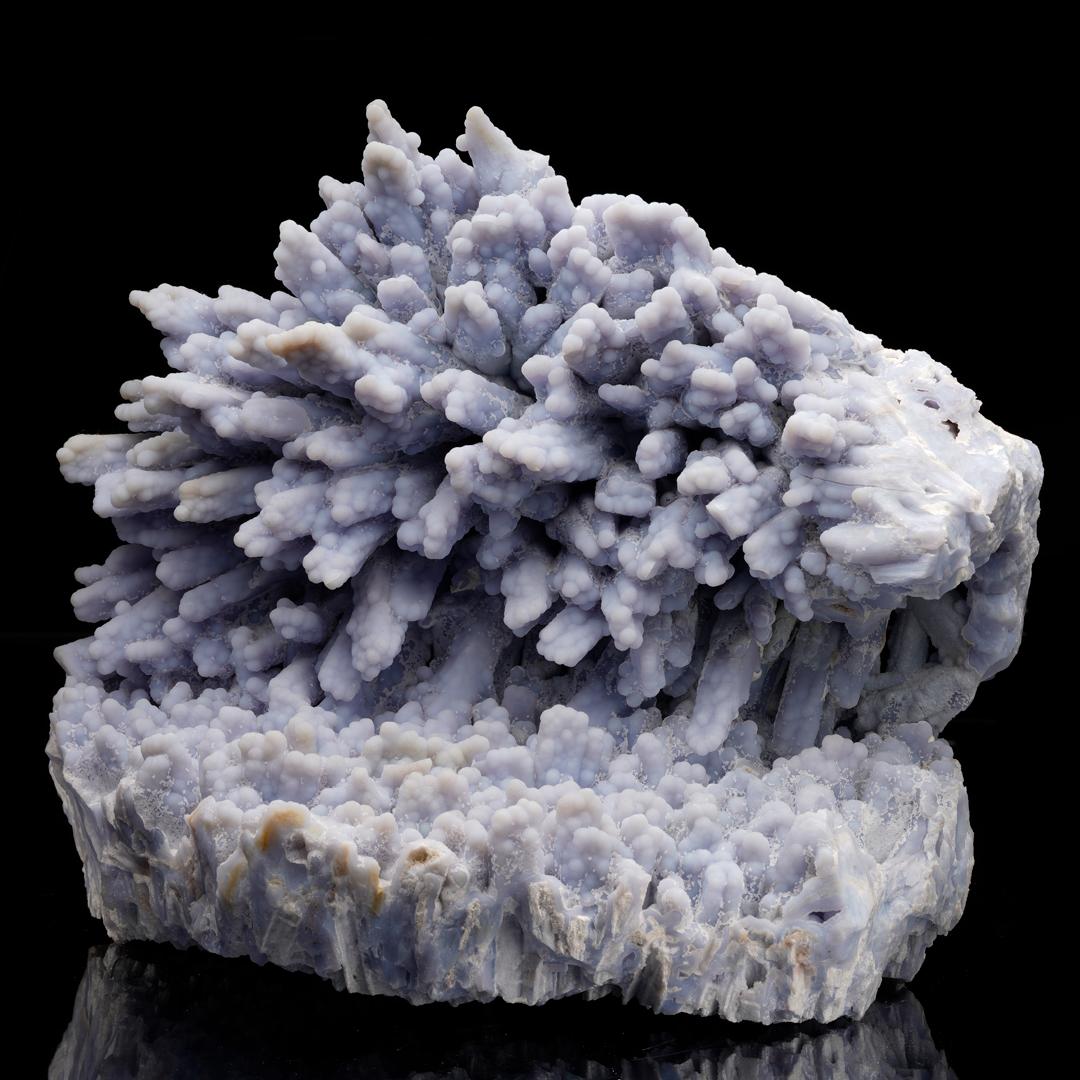 This is the finest specimen pulled out of the historic pocket in Rumipata, Ichuña District, Moquegua, Peru – impressive not only for its gorgeous lilac coloring but also for its sheer size and its bold crystal structures. Here chalcedony (a species