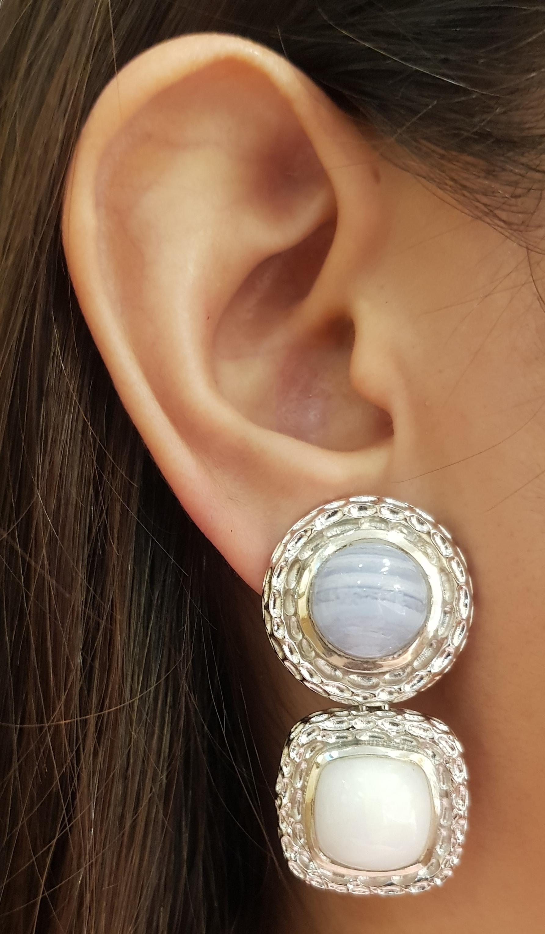 Chalcedony and Agate Earrings set in Silver Settings

Width: 2.0 cm 
Length: 4.2 cm
Total Weight:  32.34 grams

*Please note that the silver setting is plated with rhodium to promote shine and help prevent oxidation.  However, with the nature of