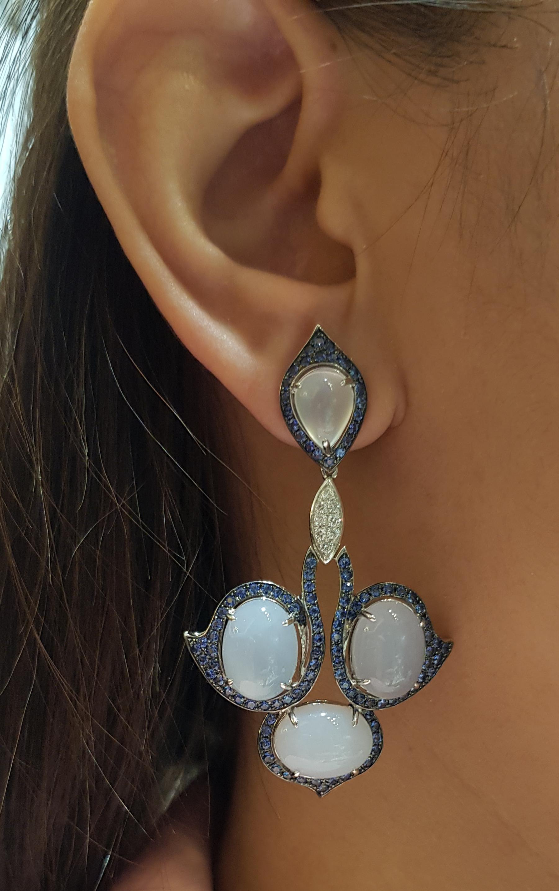Chalcedony 23.91 carats, Moonstone 3.56 carats, Blue Sapphire 2.71 carats and Diamond 0.19 carat Earrings set in 18 Karat White Gold Settings

Width:  3.5 cm 
Length:  6.0 cm
Total Weight: 26.31 grams

