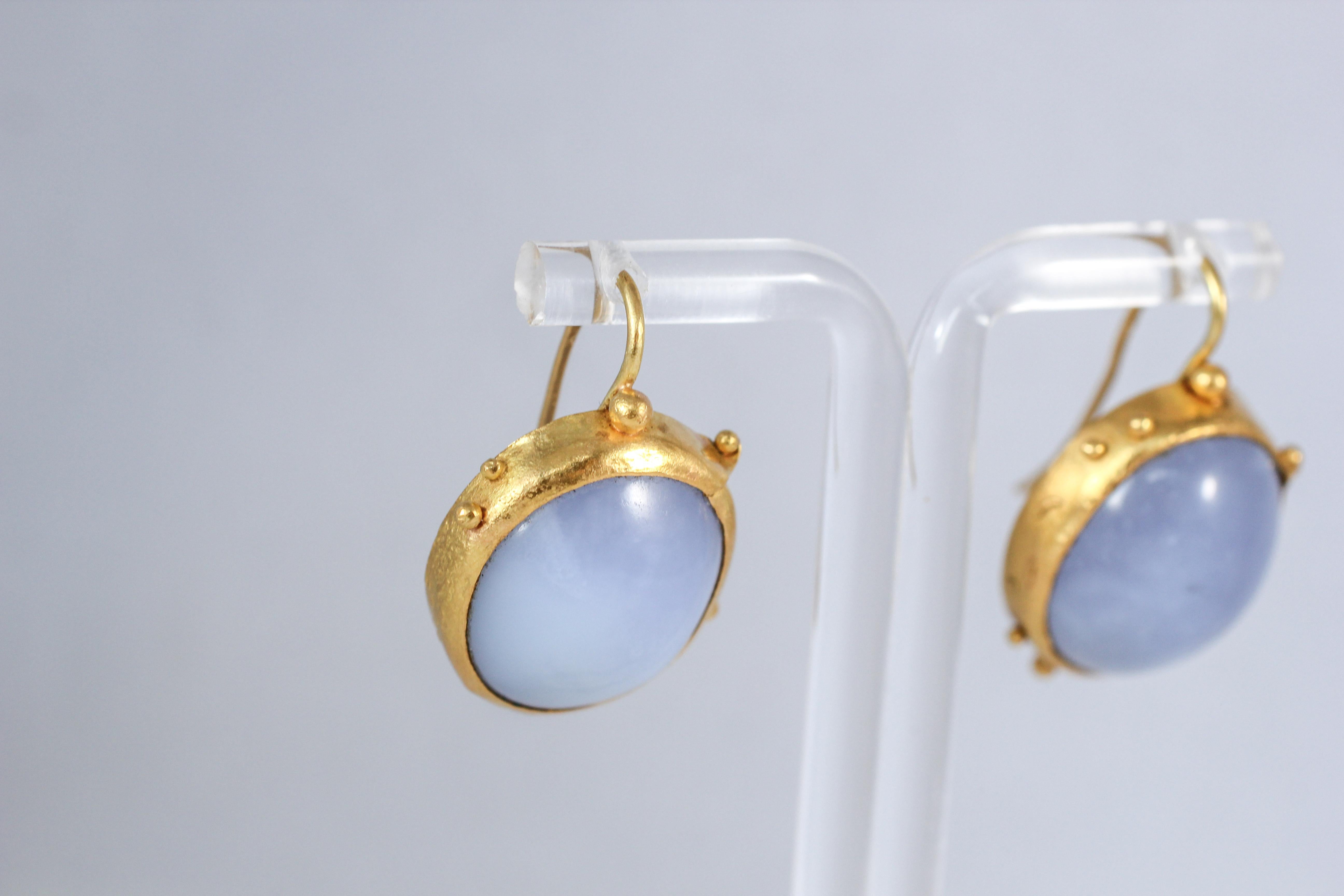 Summer Sky earrings. These subtle purple-blue chalcedony and 22k gold drop earrings will make an elegant addition to any outfit. They are very comfortable and are easy to coordinate for everyday wear. Slightly asymmetrical.

The inspiration for