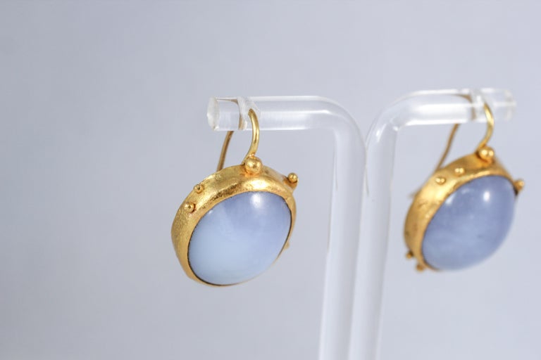 Summer Sky earrings. These subtle purple-blue chalcedony and 22k gold drop earrings will make an elegant addition to any outfit. They are very comfortable and are easy to coordinate for everyday wear.

The inspiration for these modern earrings comes