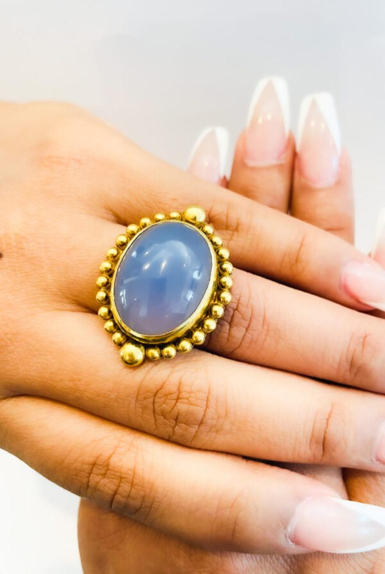 This classic old world granulated oval Chalcedony ring is set in 22k gold and hand made using the ancient art of goldsmithing. One of a kind wearable art. 18x20mm, size 7 1/2, please contact for resizing

The Tagili Promise: For every piece sold a