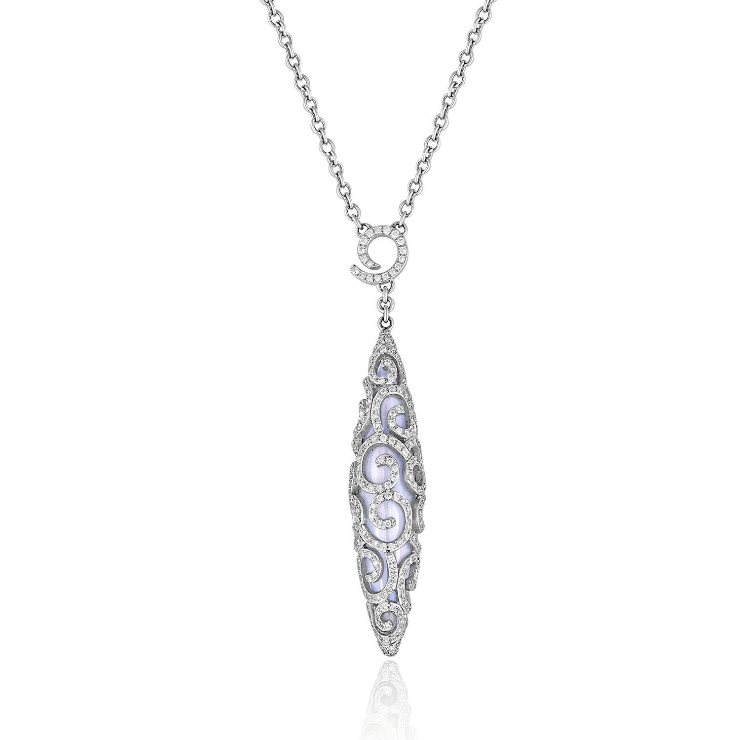 Pendant Necklace with Diamond scroll design
The necklace is 14K White Gold
1.03Ct of Diamonds
Inside is a Chalcedony Stone
The pendant measures 2