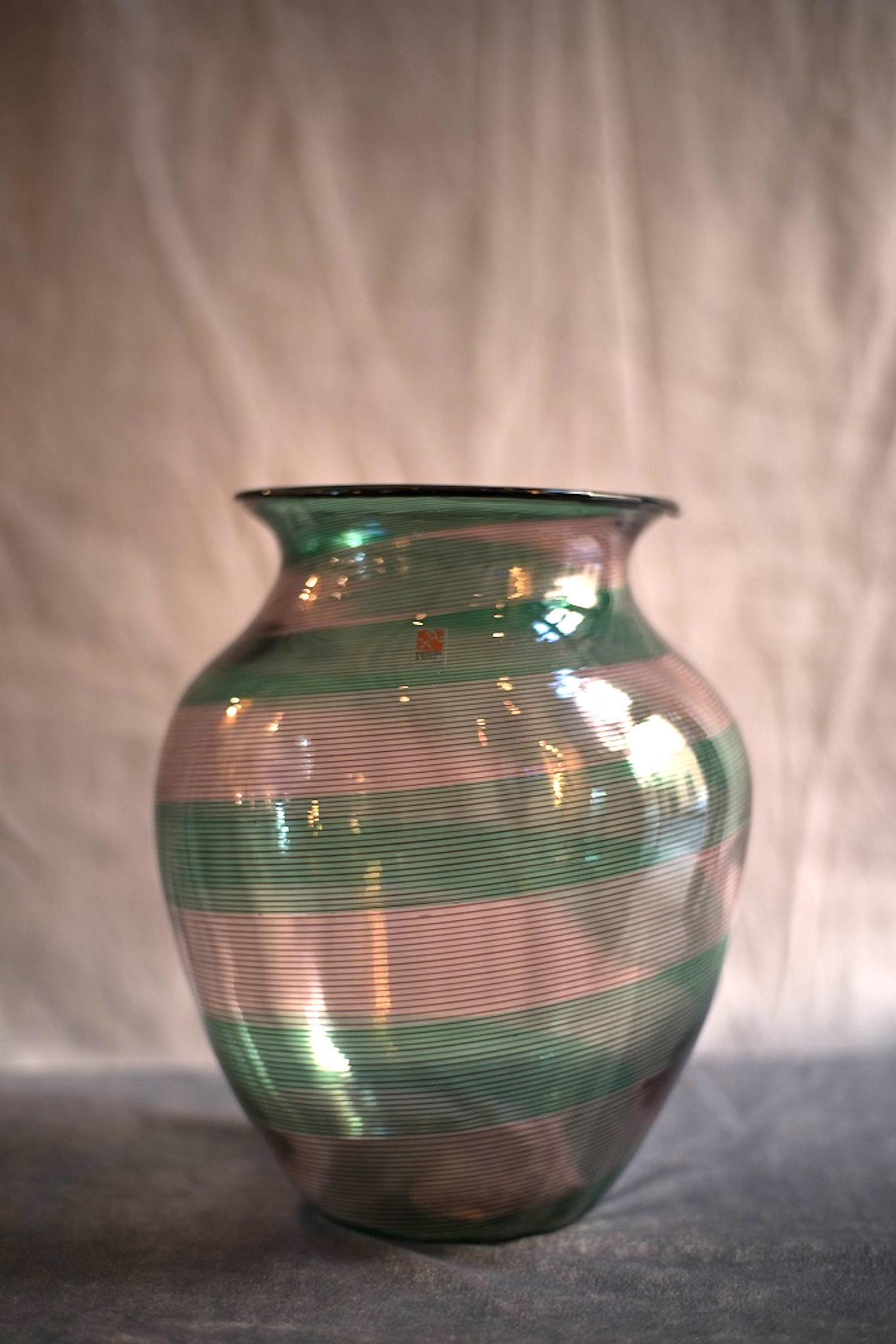 This Chalcedony glass vase is a refined decorative object realized by Barovier & Toso in Murano (Venice) in the 1980s.

Chalcedony glass vase with the surface crossed by pink and red stripes.

Label of the Company applied.

Excellent