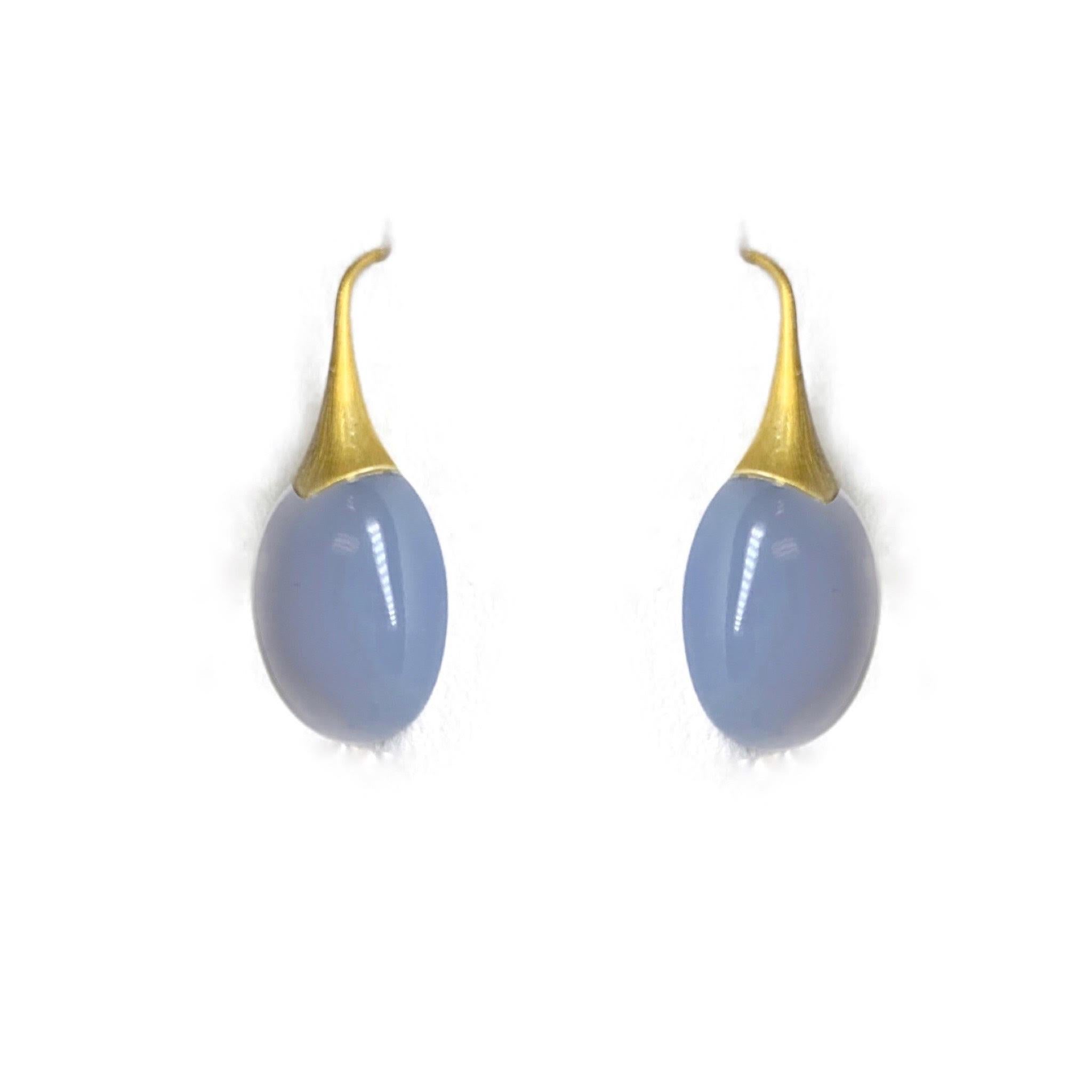 These gorgeous Chalcedony hanging earrings are great for any occasion. With a pale white color these earrings go with everything. 
A2 by Arunashi
Chalcedony on Trumpet Earrings
18 Karat Yellow Gold
Chalcedony weighing 36.75 carats 
Chalcedony is a
