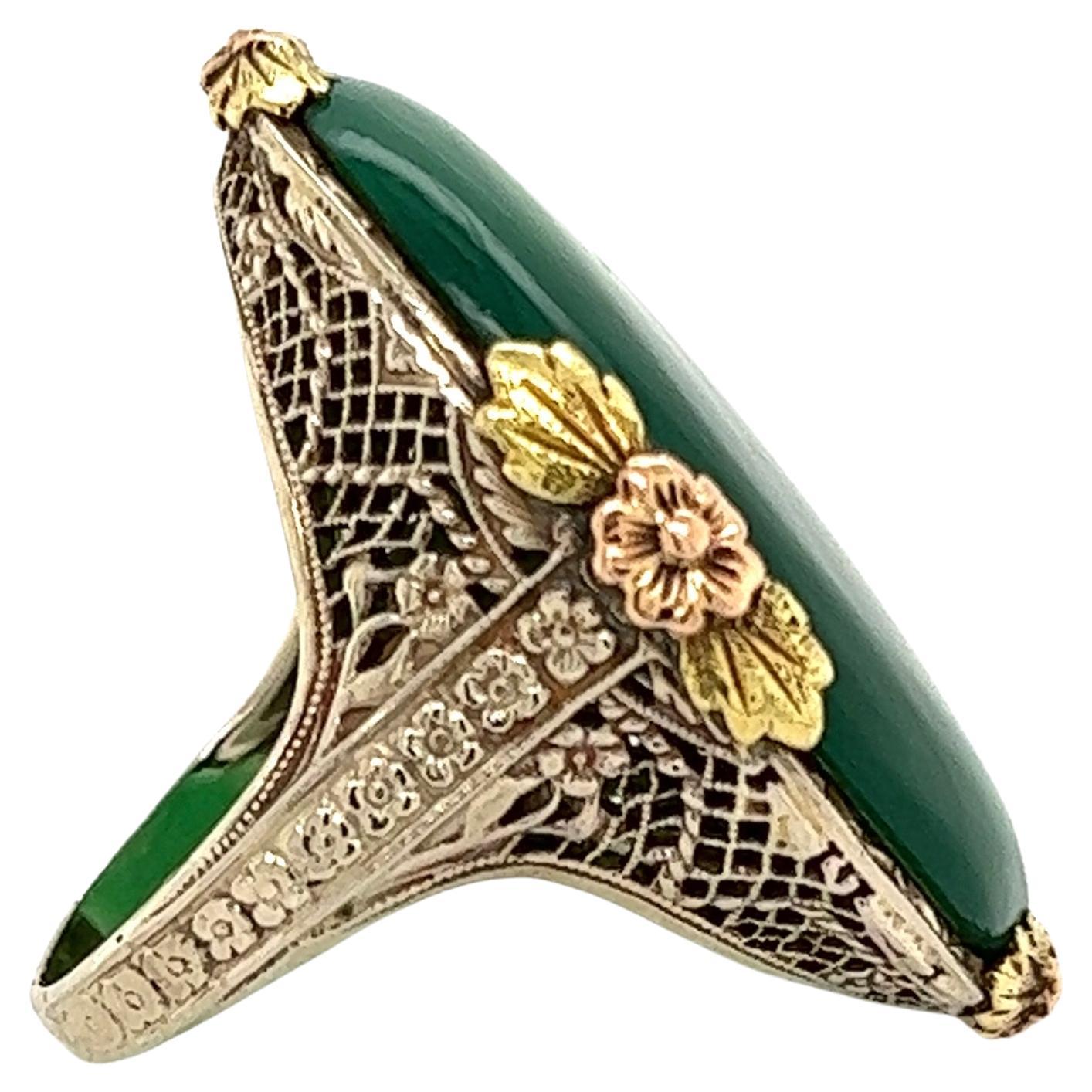 Simply Beautiful! Solitaire Chalcedony Tri Tone Arts & Crafts Cocktail Ring. Centering a Hand set securely nestled Green Chalcedony. Artistically Hand crafted Rose, White and Yellow 14K Gold mounting. Approx. Dimensions of the ring: 0.99