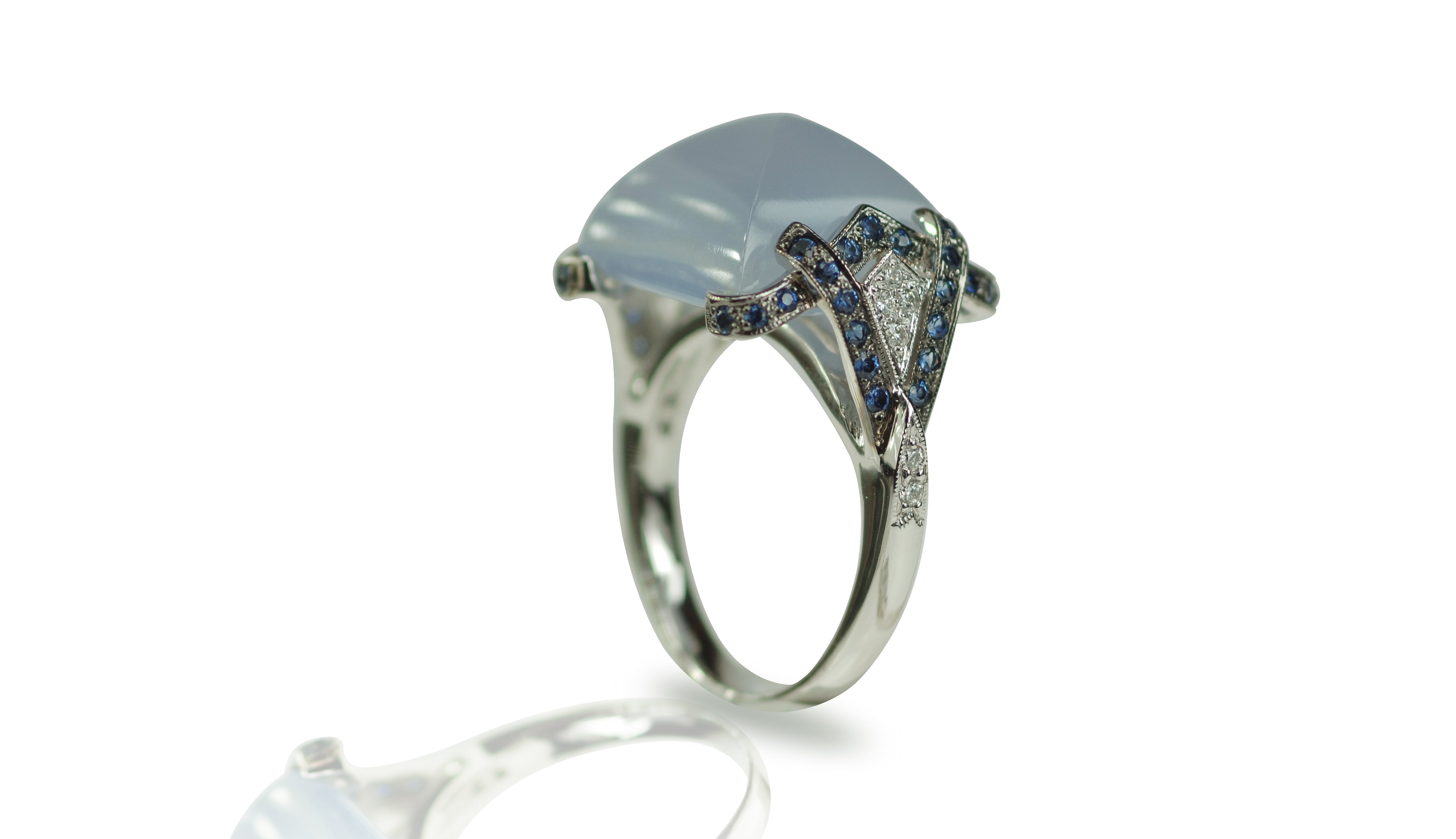 Chalcedony 13.25 carats with Blue Sapphire 0.52 carat and Diamond 0.11 carat Ring set in 18 Karat White Gold Settings

Width:  2.1 cm 
Length: 1.7 cm
Ring Size: 54
Total Weight: 9.56 grams

