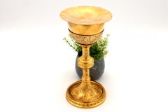 Chalice with gilded silver paten with reliefs, friezes and circular base