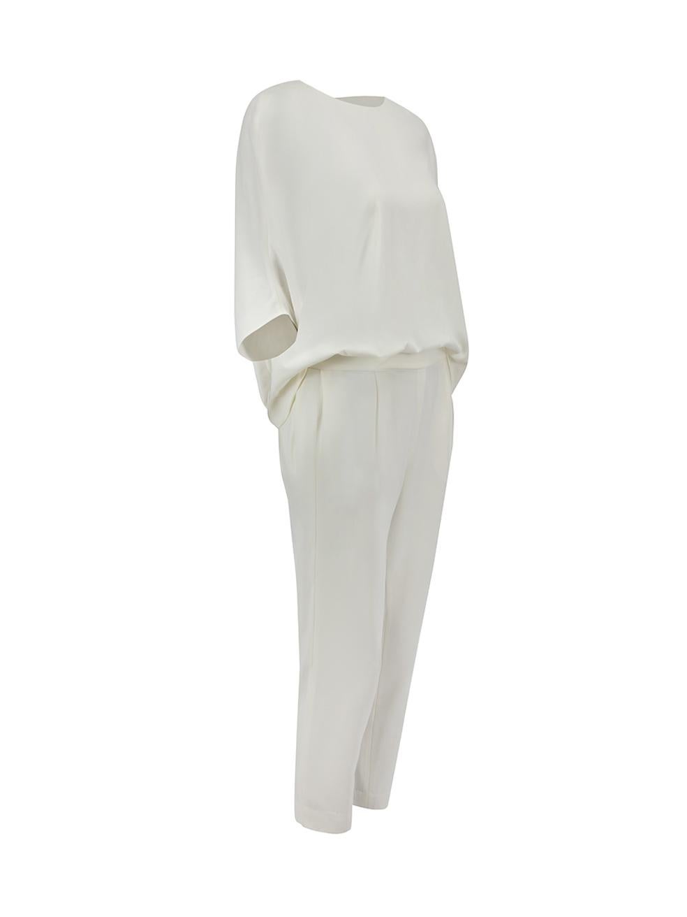 CONDITION is Never worn, with tags. No visible wear to jumpsuit is evident on this new Halston Heritage designer resale item.



Details


Chalk white

Polyester

Jumpsuit

Bat wing top

Short sleeves

Round neck

Back button fastening

Back keyhole
