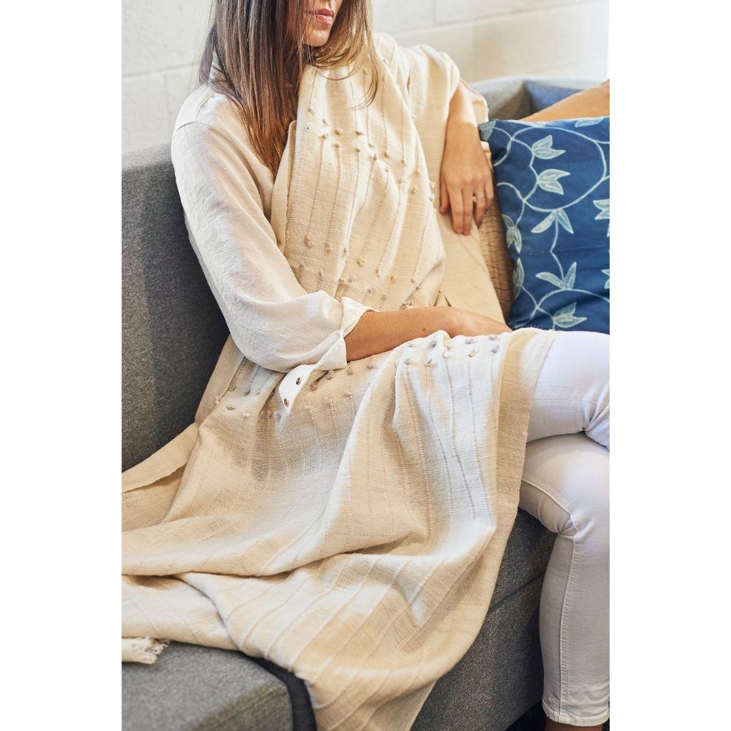 Custom design by Studio Variously, Chalk Throw is handwoven by master weavers in Nepal and dyed entirely with earth friendly dyes in soft 100% merino yarn that is hand spun.

A sustainable design brand based out of Michigan, Studio Variously