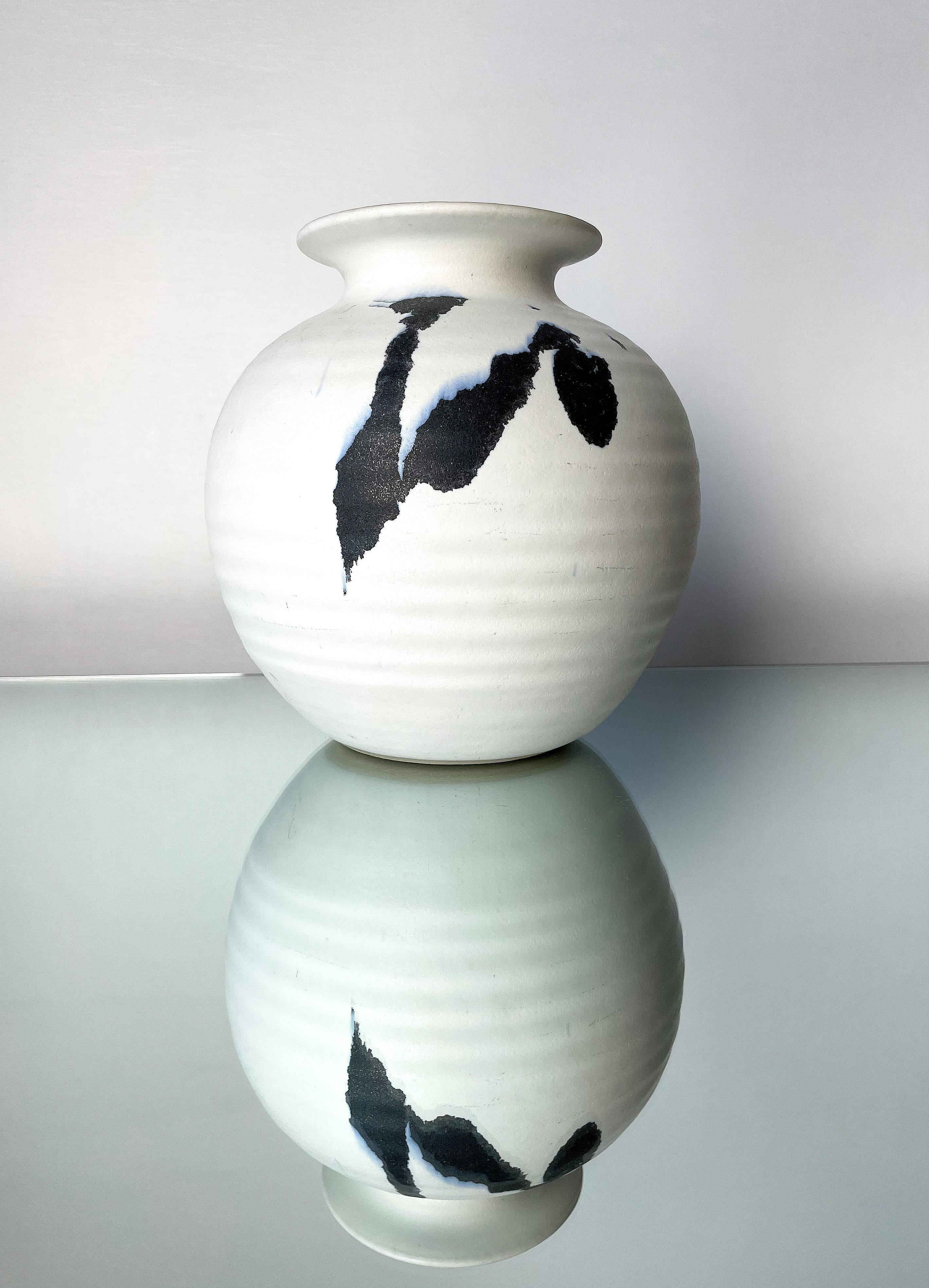 Nordic modernist matte, chalk white spherical rippled ceramic vase with anthracite and light blue running accents, and small light blue tear drops. Designed and handmade by Danish ceramic artist Karsten Nielsen for KN Stentøj in the small town of