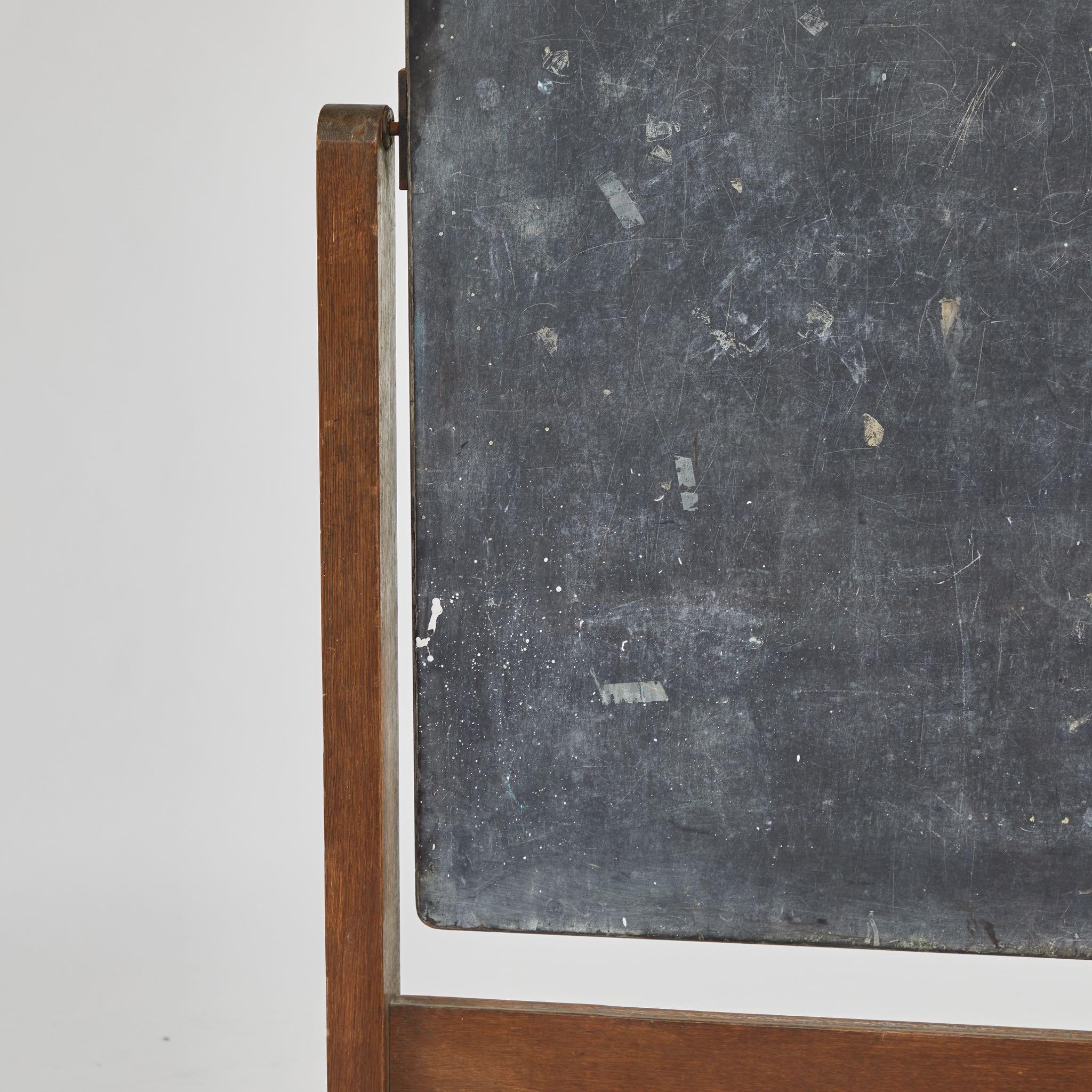 A chalkboard on stand with hinge, originating in England, circa 1910.