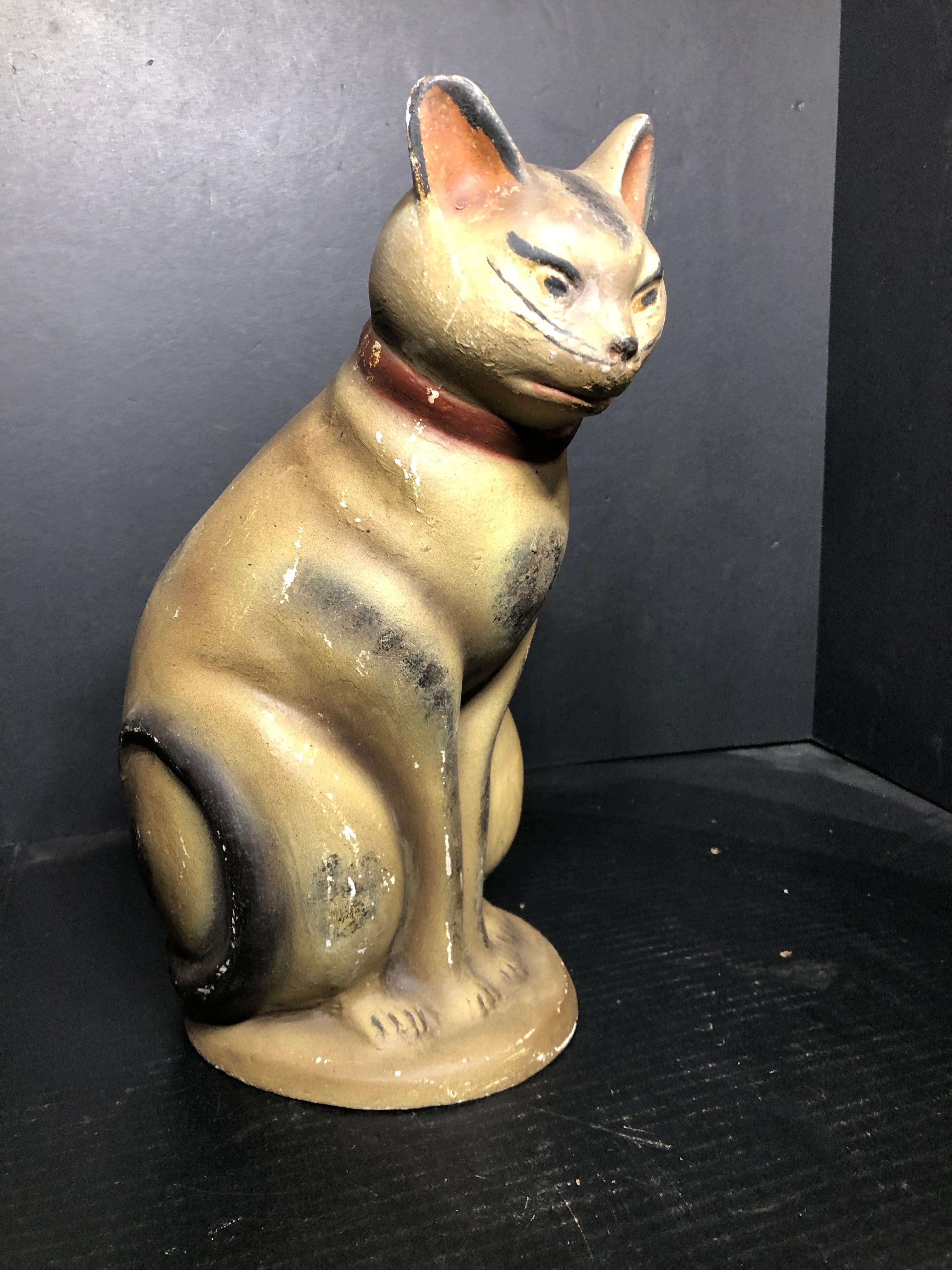 American. A large painted and smoke decorated 19th century chalkware cat figure; oah. Measures: 14.75 in.