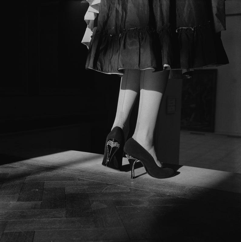 "Fancy Heel" by Chaloner Woods

15th November 1955: Stiletto heeled shoes with pointed toes.The heels are decorated and the shoes are worn with stockings with seams.

Unframed
Paper Size: 30" x 30'' (inches)
Printed 2022 
Silver Gelatin Fibre Print