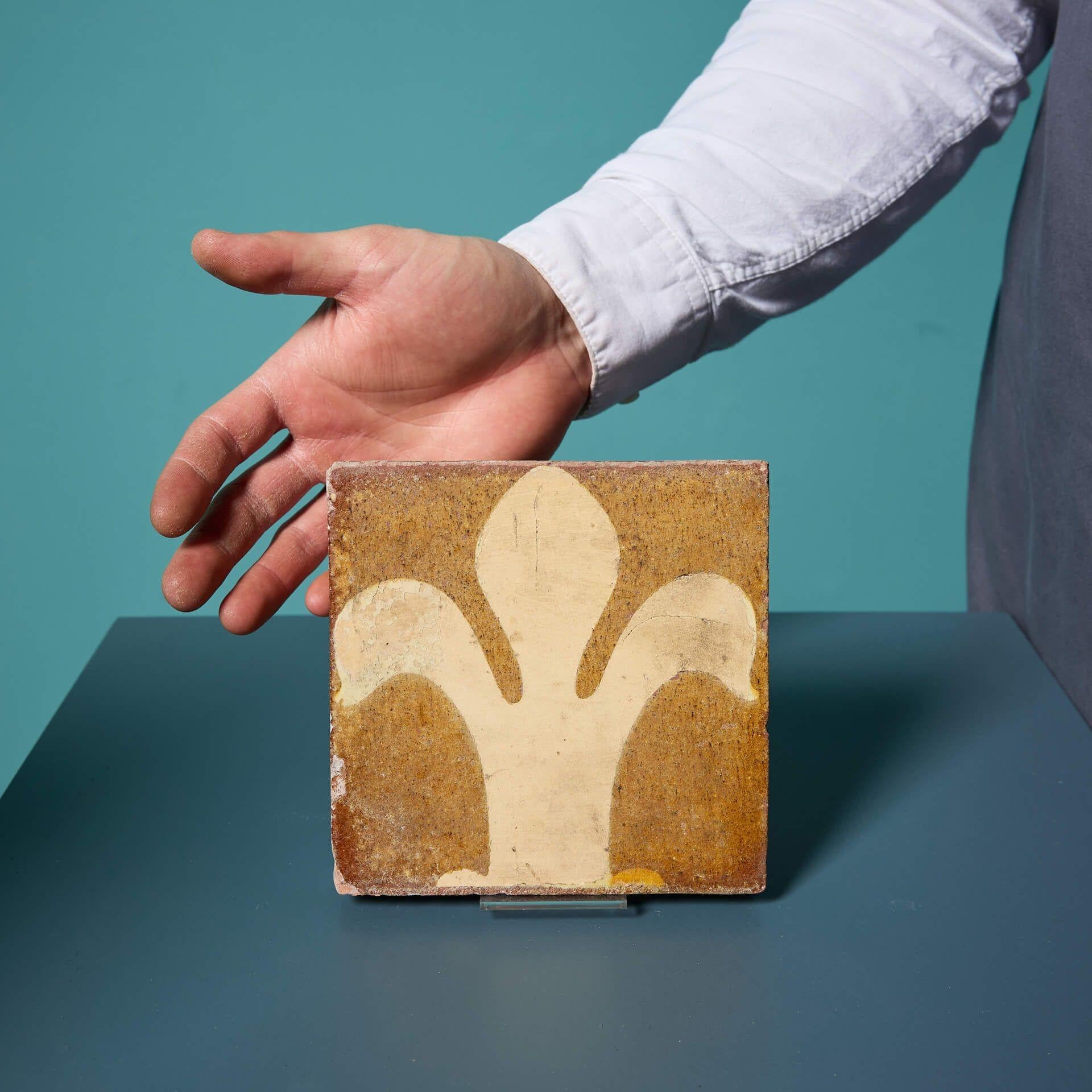 An antique French medieval style encaustic tile by Chamberlain and Co of Worcester.

This 6-inch glazed tile is a striking decorative interior piece or a welcome addition to an encaustic collector.

By the mid 19th century, new churches were under