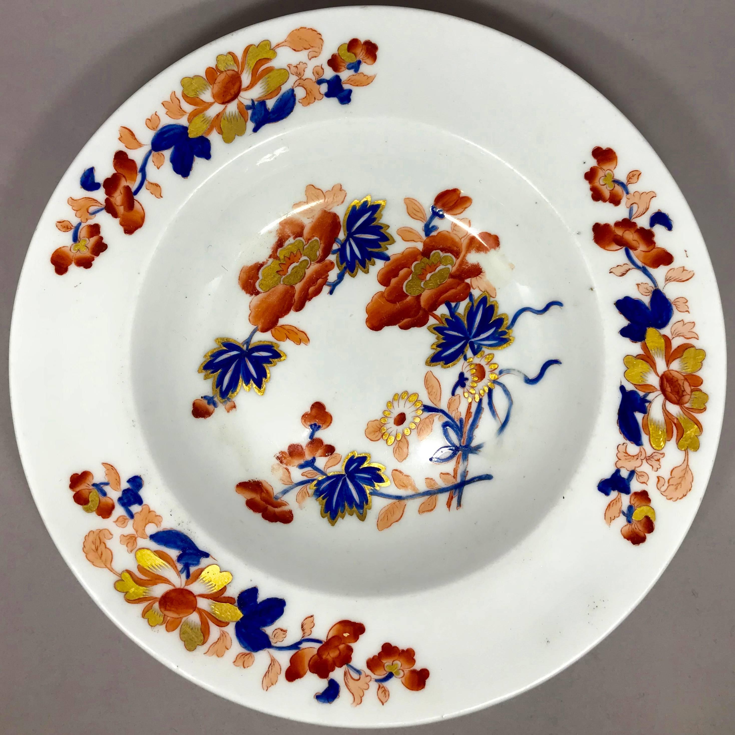 Chamberlain's Worcester Imari Soup  Plate.  Imari style decoration hand-painted soup plate in gilt, cobalt blue, iron red and peach flowers. Hand applied marks for Chamberlain's Regent China Worcester No. 133 New Bond Street, London, England, circa